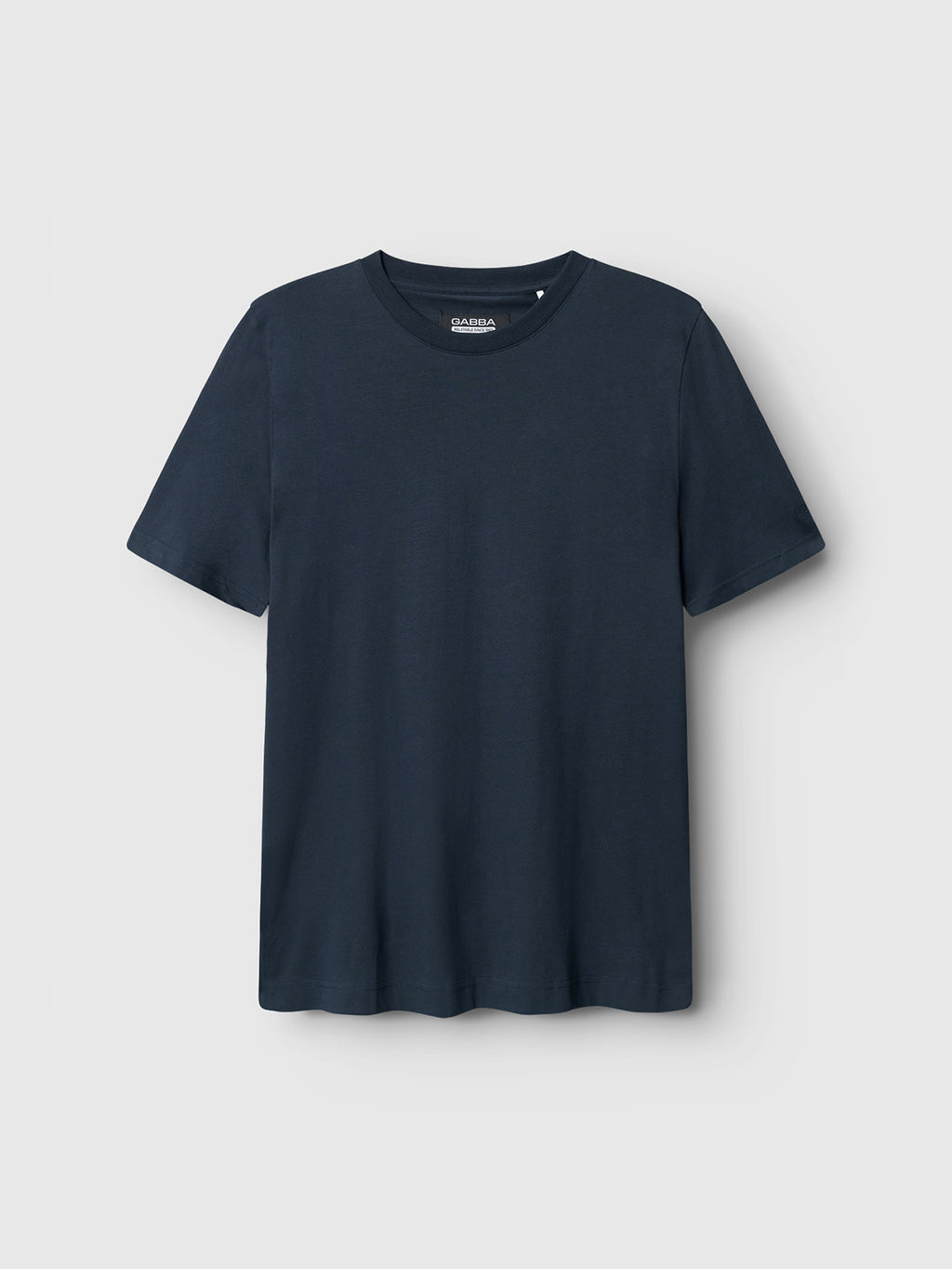 The Dune SS GOTS Tee by Gabba is a plain dark grey basic t-shirt on a light grey background, crafted from organic cotton. It features a round neckline and short sleeves with no visible logos or designs.