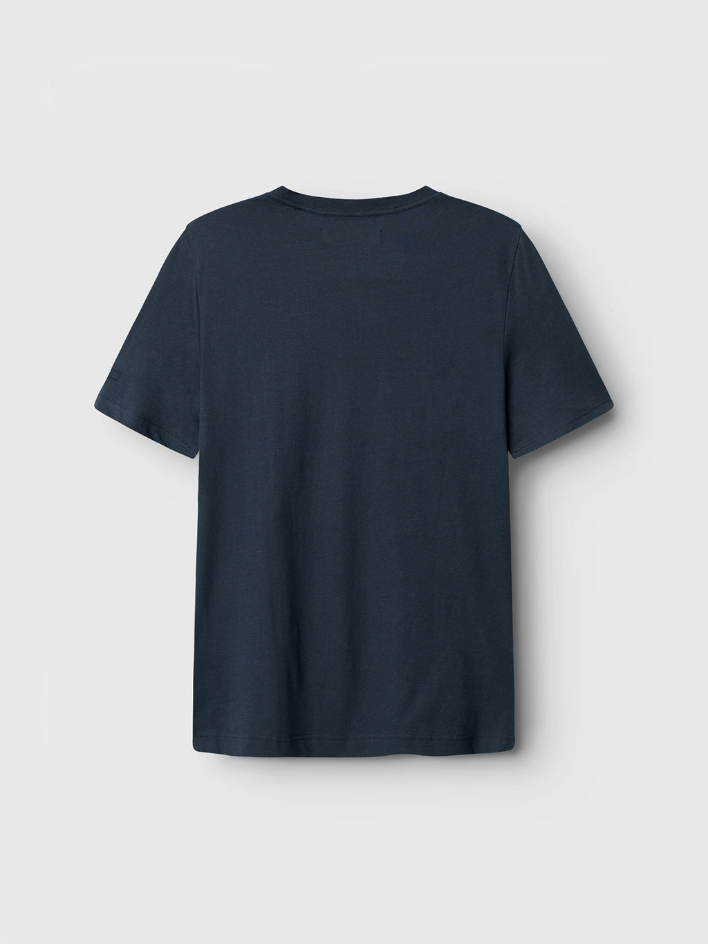 The Gabba Dune SS GOTS Tee in Total Eclipse is a plain dark green T-shirt made from GOTS-certified organic cotton, shown from the back against a light gray background. It has short sleeves and a minimalist design without visible patterns or logos.