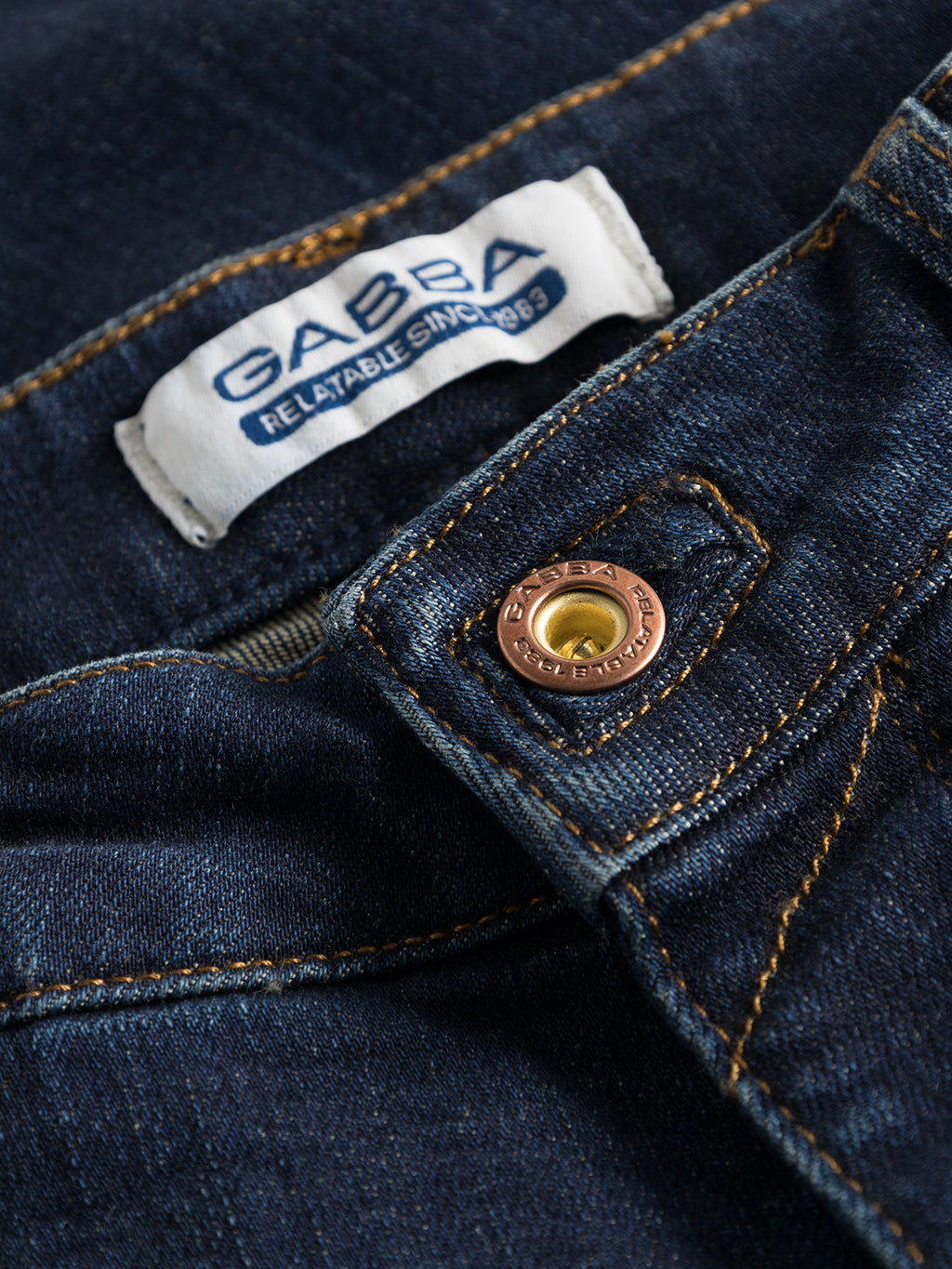 Close-up of Rey K4441 - Mid Blue Denim jeans with contrast stitching, ideal for a laid-back style. Featuring a button and Gabba Relatable Since 1983 label, it offers a timeless and slim appearance.
