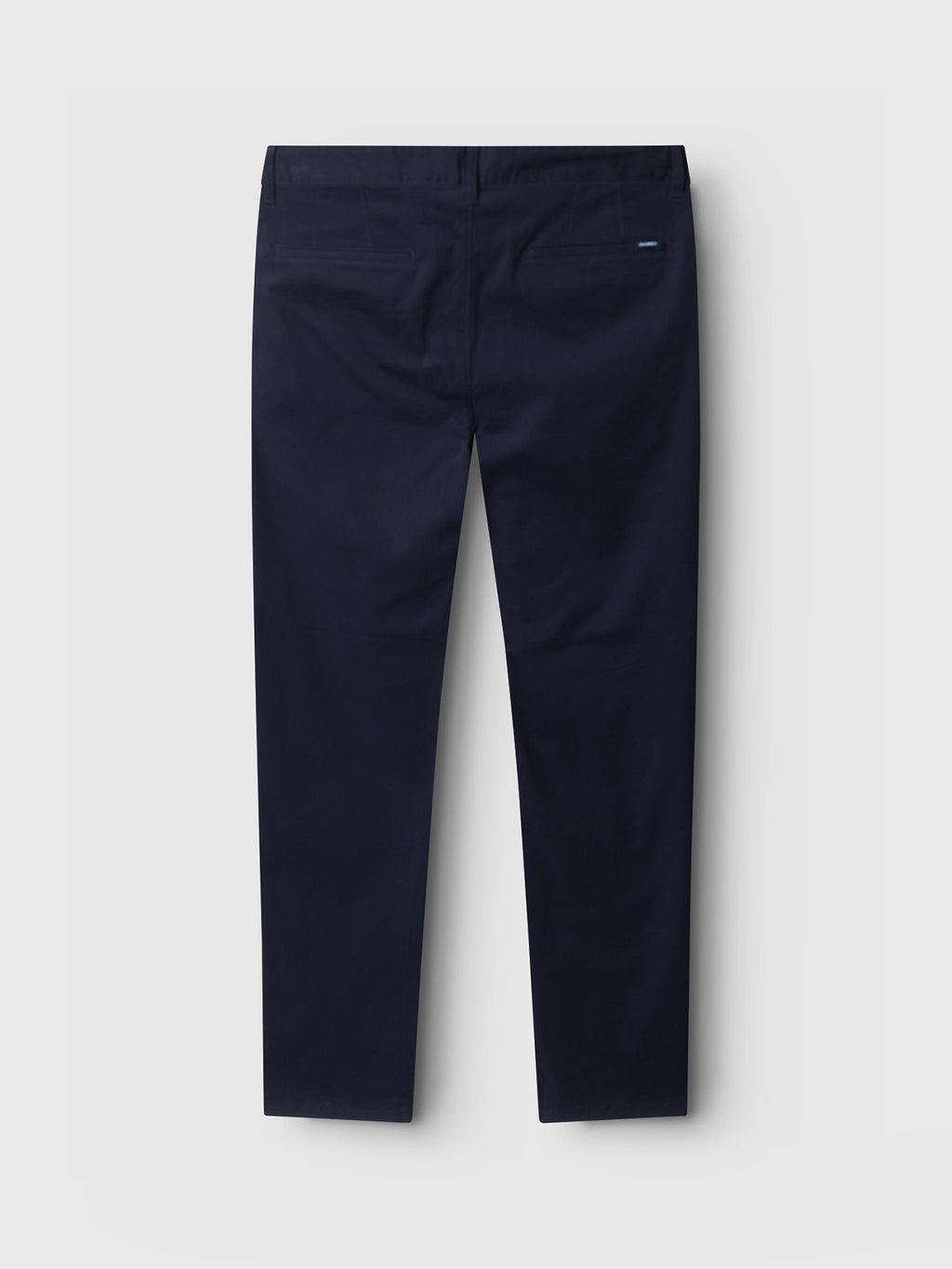 Flat against a light gray background, the Venza Chino in navy, by Gabba, showcases its timeless style with two back welt pockets and a small brand tag above the right pocket—a classic staple for any mens wardrobe.