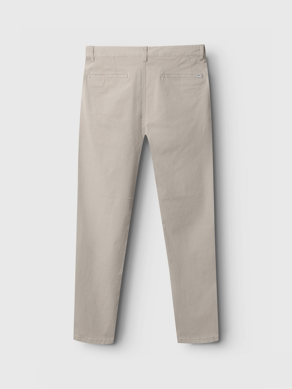 The Venza Chino in Lt. Sand by Gabba is shown from the back, highlighting two back pockets. These regular fit chinos feature a minimalist design with a flat waistband and straight-leg cut against a plain white backdrop—an essential for any mens wardrobe.