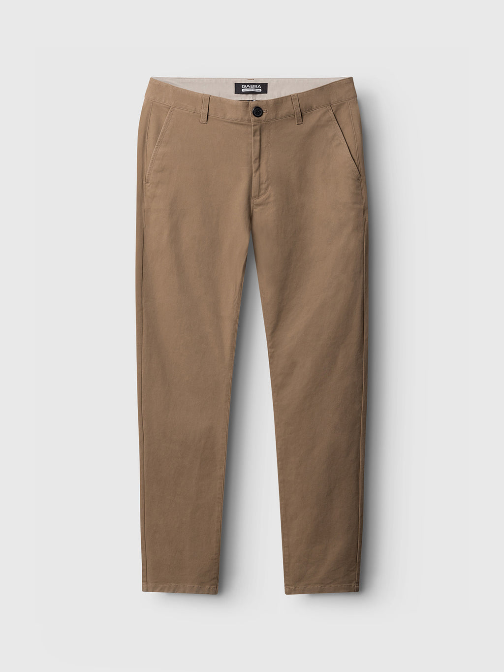 The Venza Chino by Gabba, in a khaki tone, is showcased on a light gray background. These regular fit pants have a button-zip closure, two slanted front pockets, and a straight leg design, ideal for any mens wardrobe versatility.