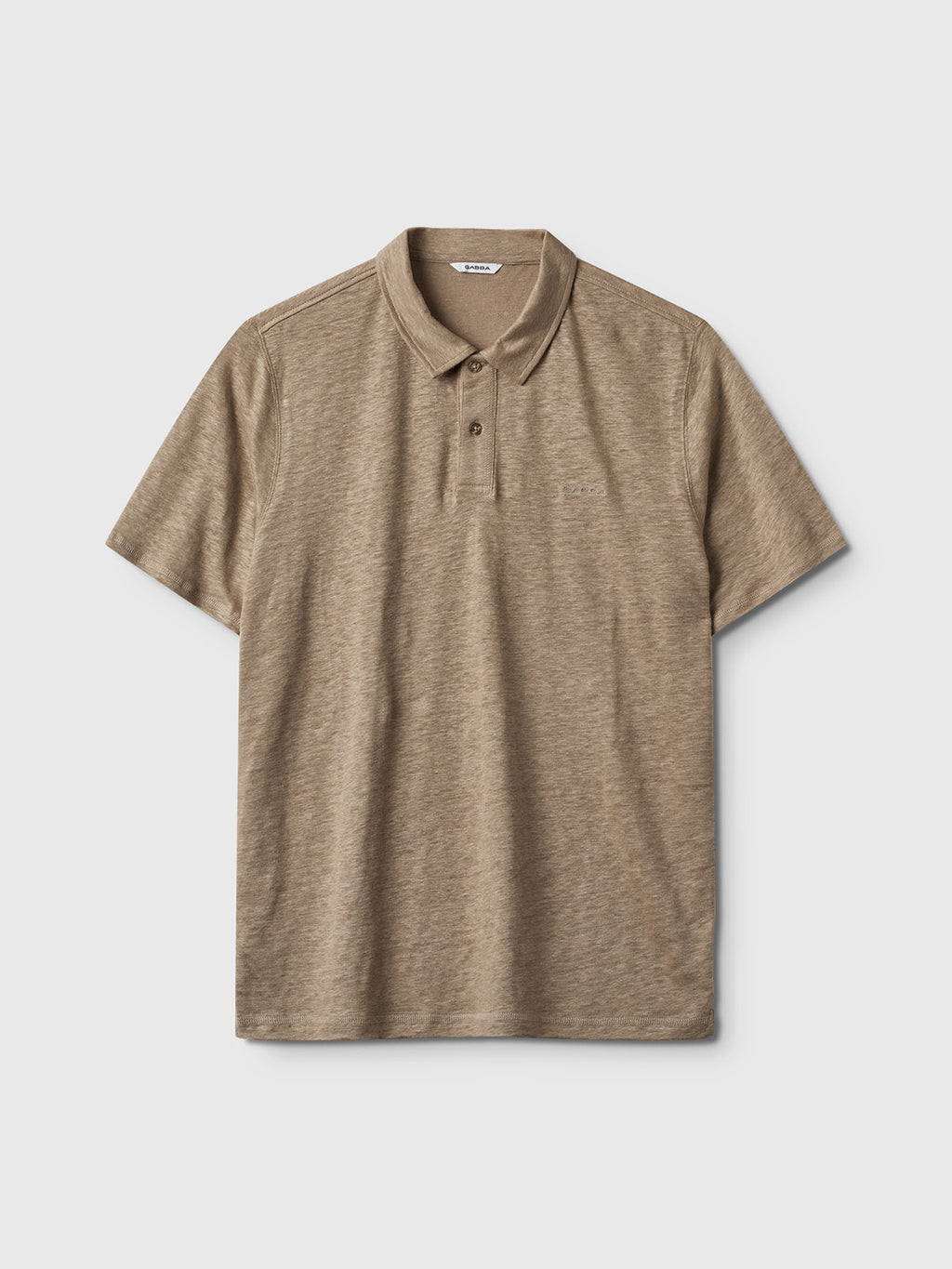 The Gabba Duke Linen Polo SS in Coriander, featuring a modern fit with short sleeves, collar, and button-up placket, is displayed against a plain light gray background.