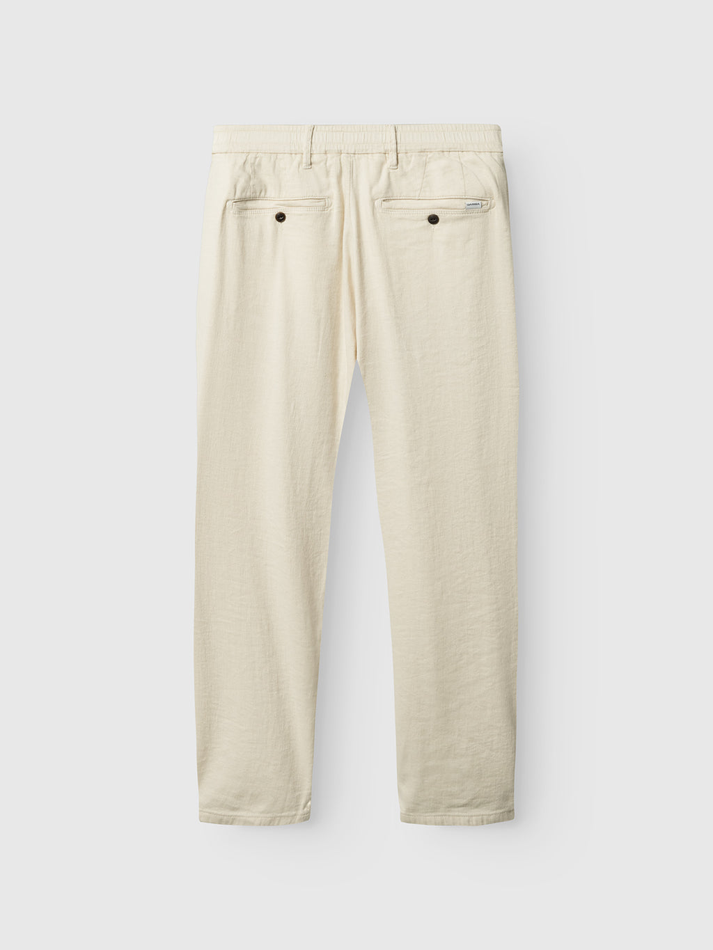 Laid flat on a light gray background, the back view of Gabbas Napoli 19 Twill Linen in Birch showcases cream-colored pants with two back pockets, button closures, and an elastic waistband for added comfort.