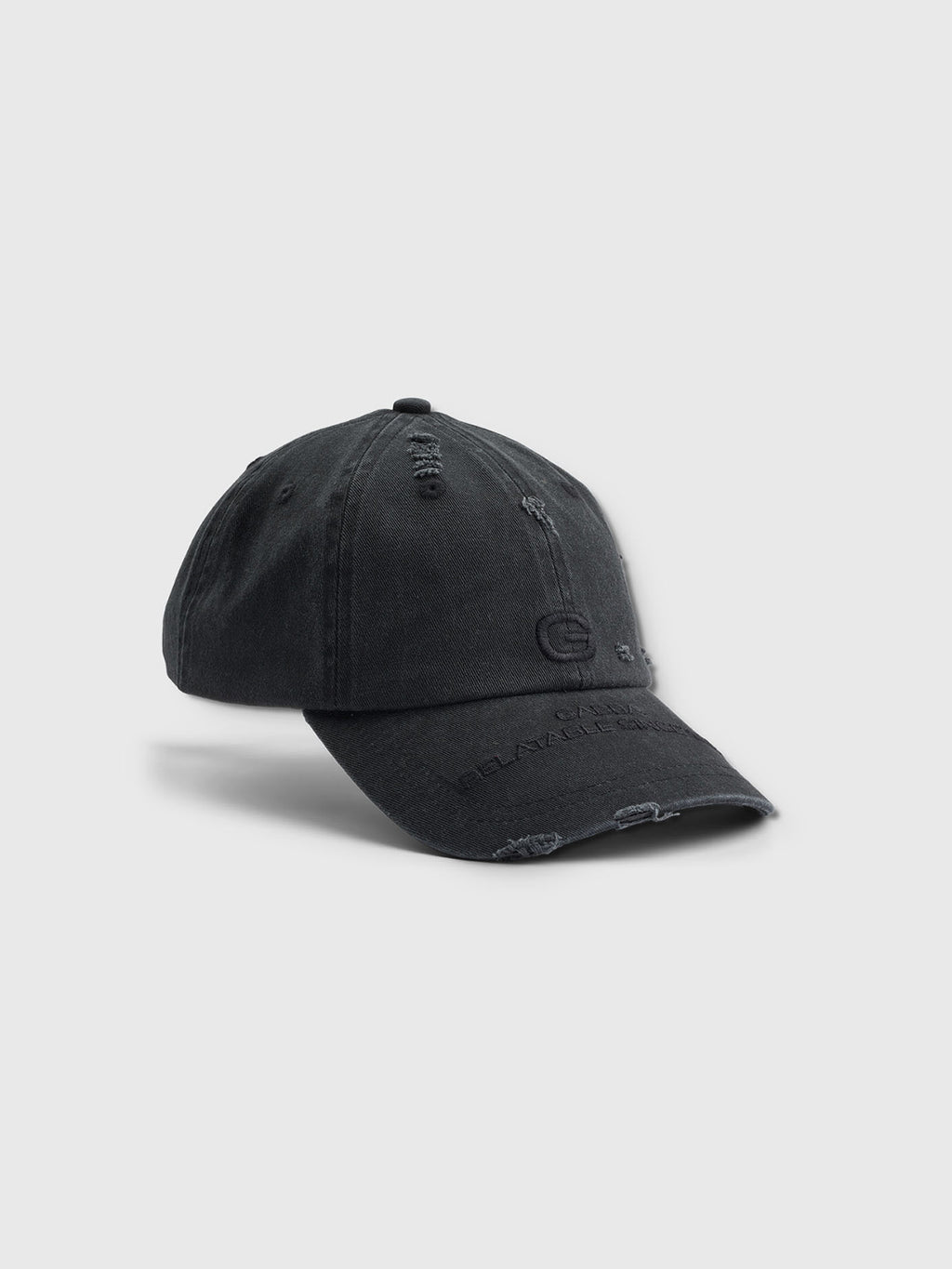 Introducing the Dad - Meteorite by Gabba: a black baseball cap with a distressed design, subtle logo embossing, and worn edges for a vintage look. Crafted from soft cotton, it features a curved brim with visible stitching for comfort and style during any casual outing.