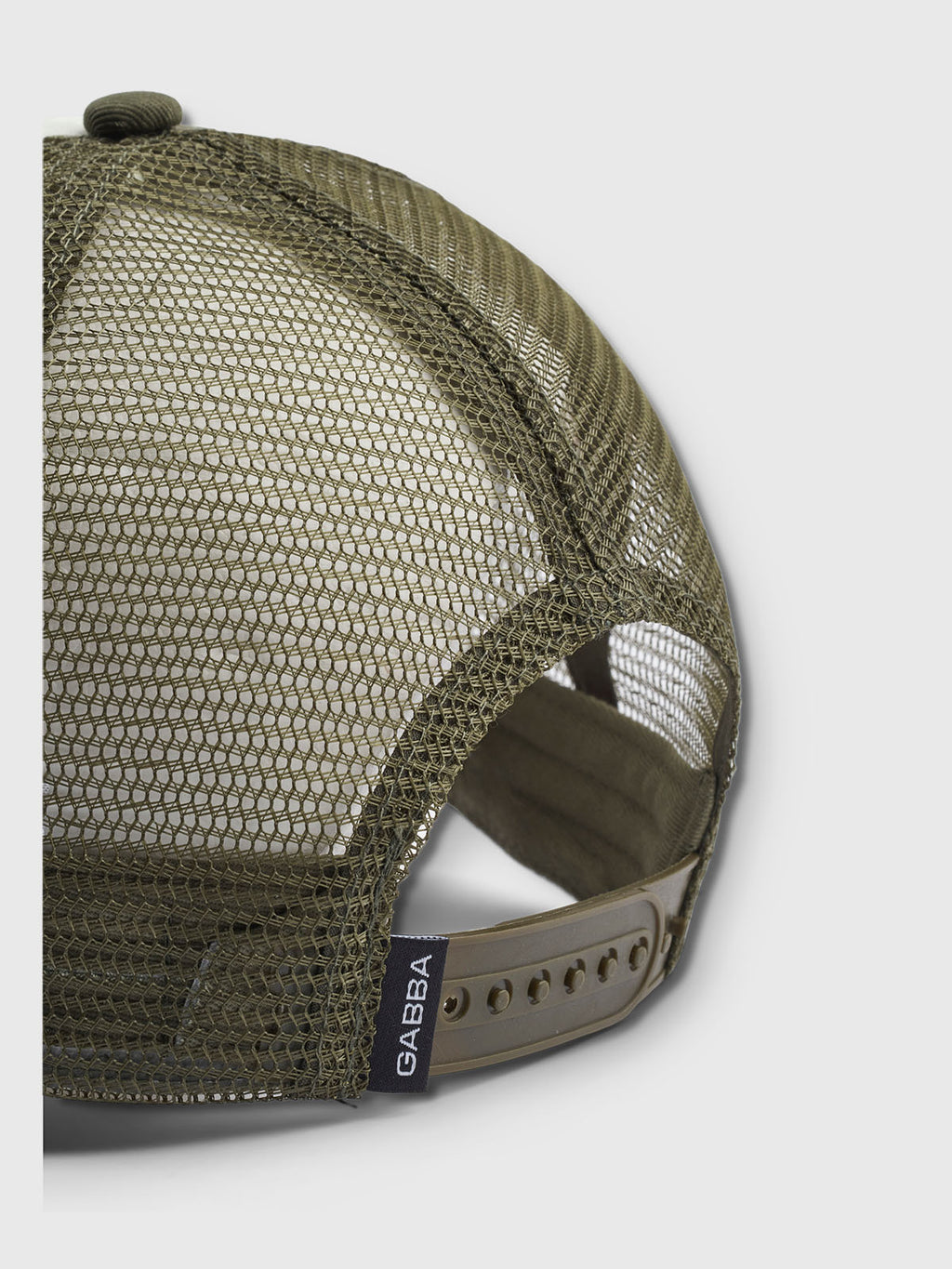 The Wolf Cam - Army by Gabba is a green mesh baseball cap featuring optimal ventilation with its airy design and adjustable strap. A plastic buckle secures the fit, while the Gabba logo tag adds style near the strap.
