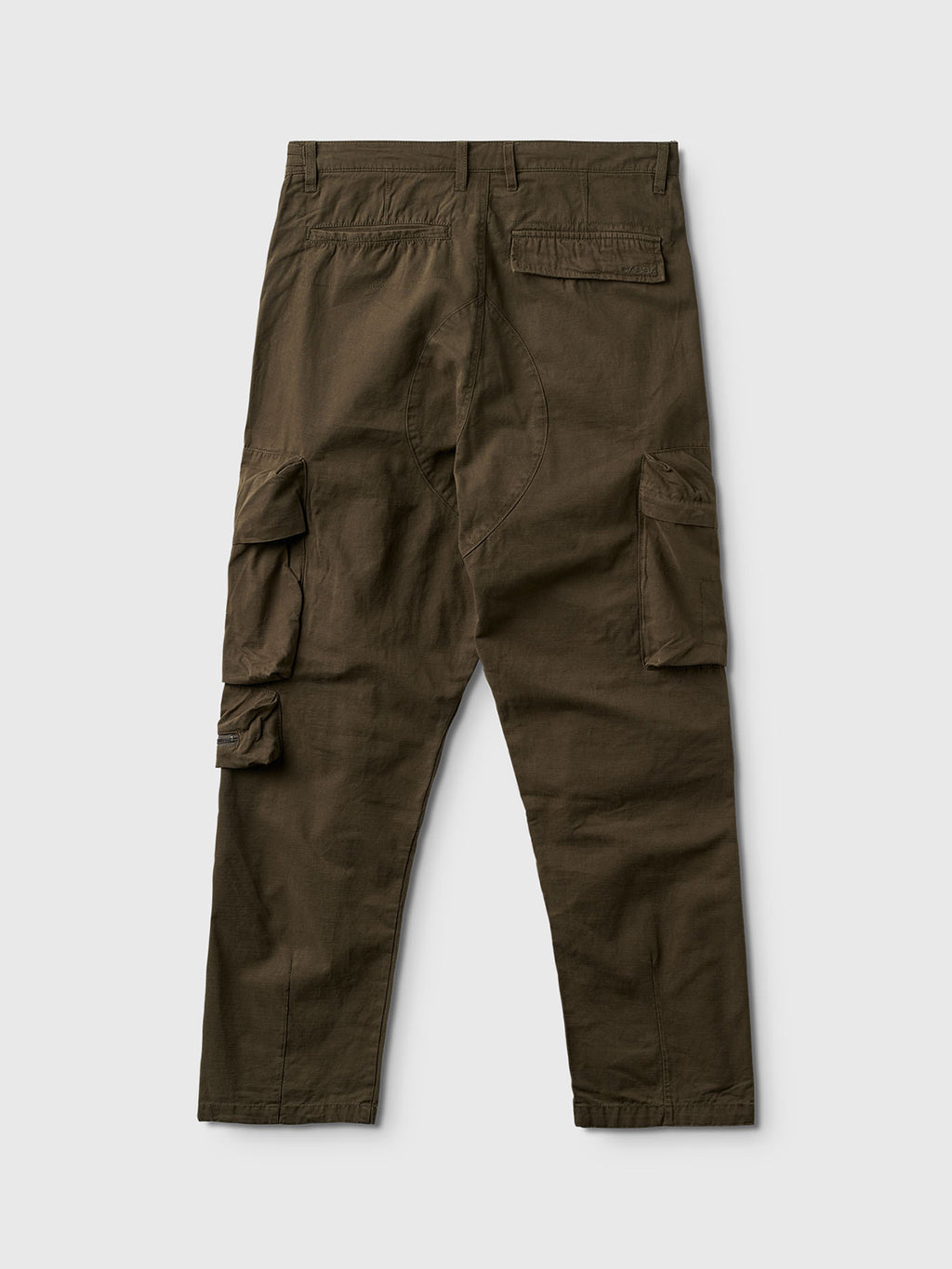 The Gabba Rodi Cargo Pant in Grape Leaf is shown flat on a light gray background, featuring spacious cargo pockets and two rear pockets. The sturdy cotton fabric highlights its casual, utilitarian style.