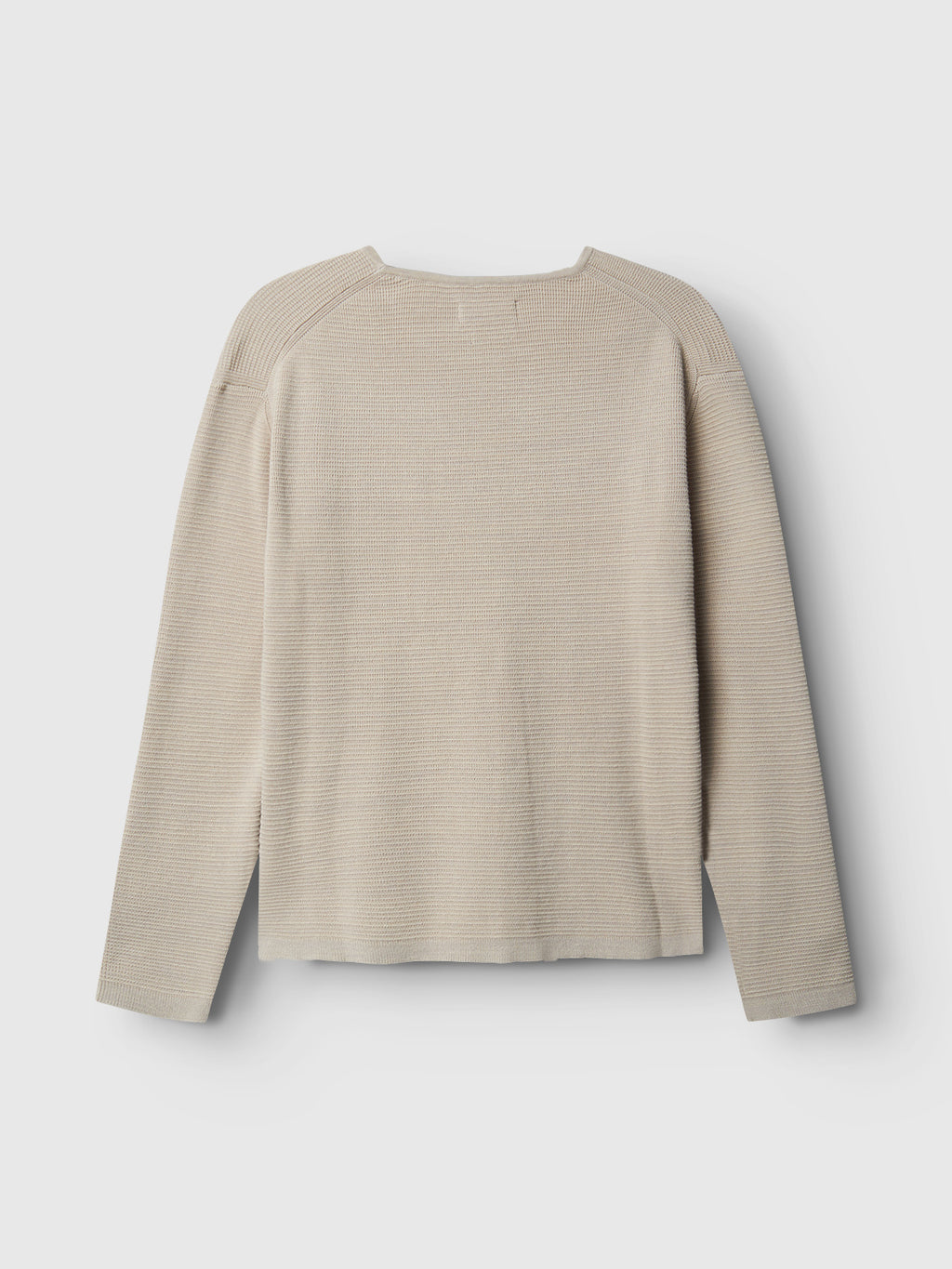 The Lambo LS - Birch by Gabba is a beige long-sleeve jumper with a textured pattern, laid flat to show the back. It features a crew neckline, slightly relaxed fit, and soft knit fabric using refined techniques, ideal for contemporary casual wear.