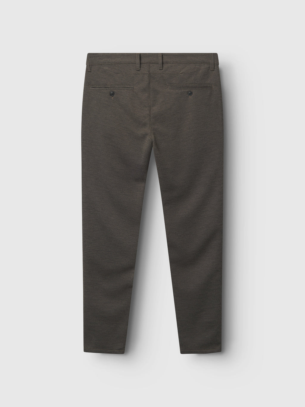Back view of Gabbas Paul GKnit pants in sand against a light gray background. They feature two rear buttoned pockets, belt loops, and a tailored design.
