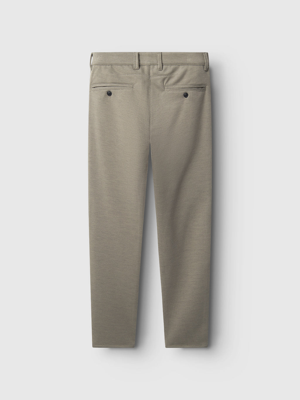 Back view of Gabba Paul GKnit slim fit dress pants in light green, featuring two back pockets with black buttons, crafted from structured fabric and displayed on a plain light background.