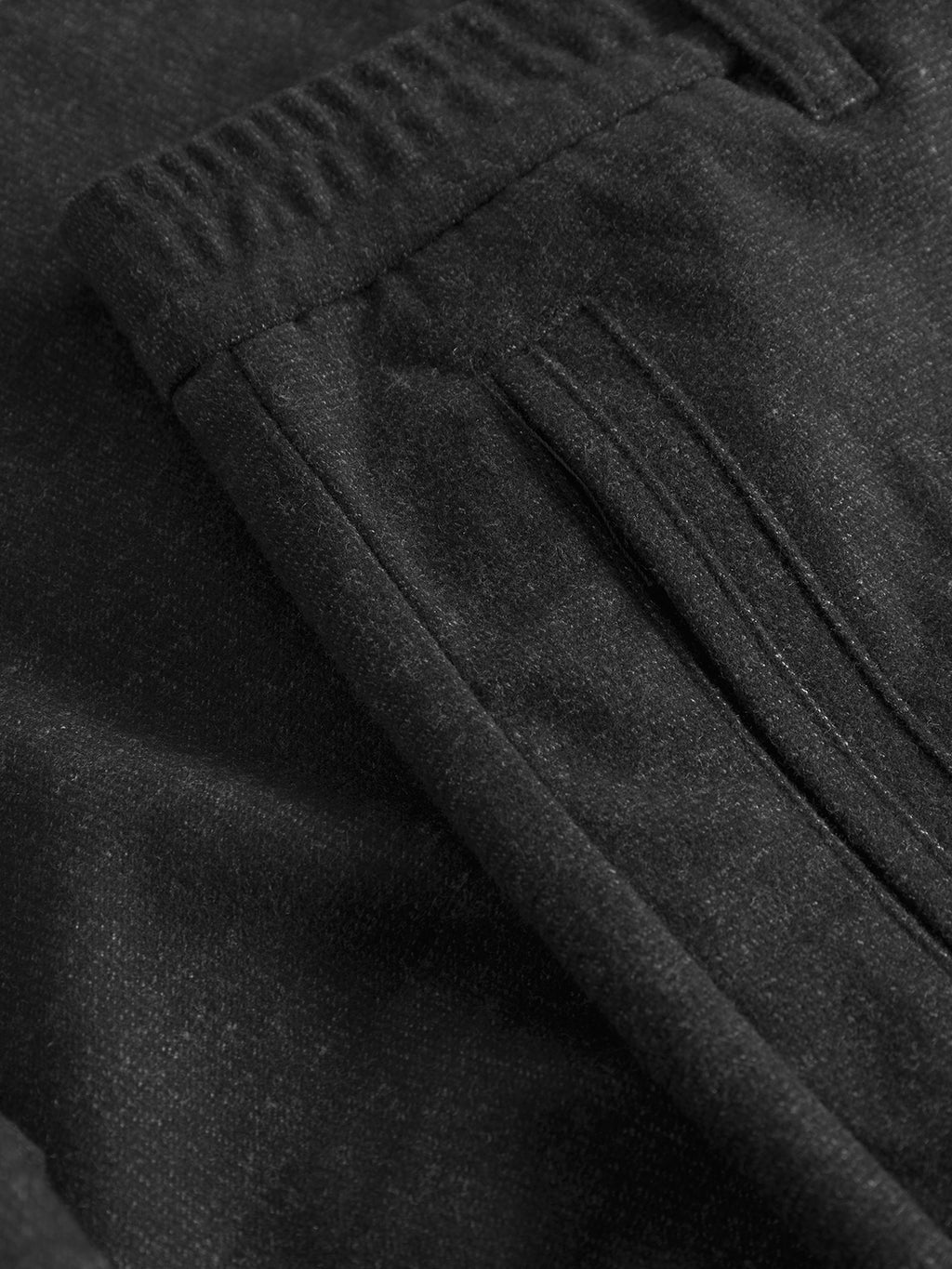 Close-up of Gabba’s Monza Shafi - Black trousers featuring a brushed stretch fabric, elastic waistband, belt loop, and a side pocket—ideal for modern style.