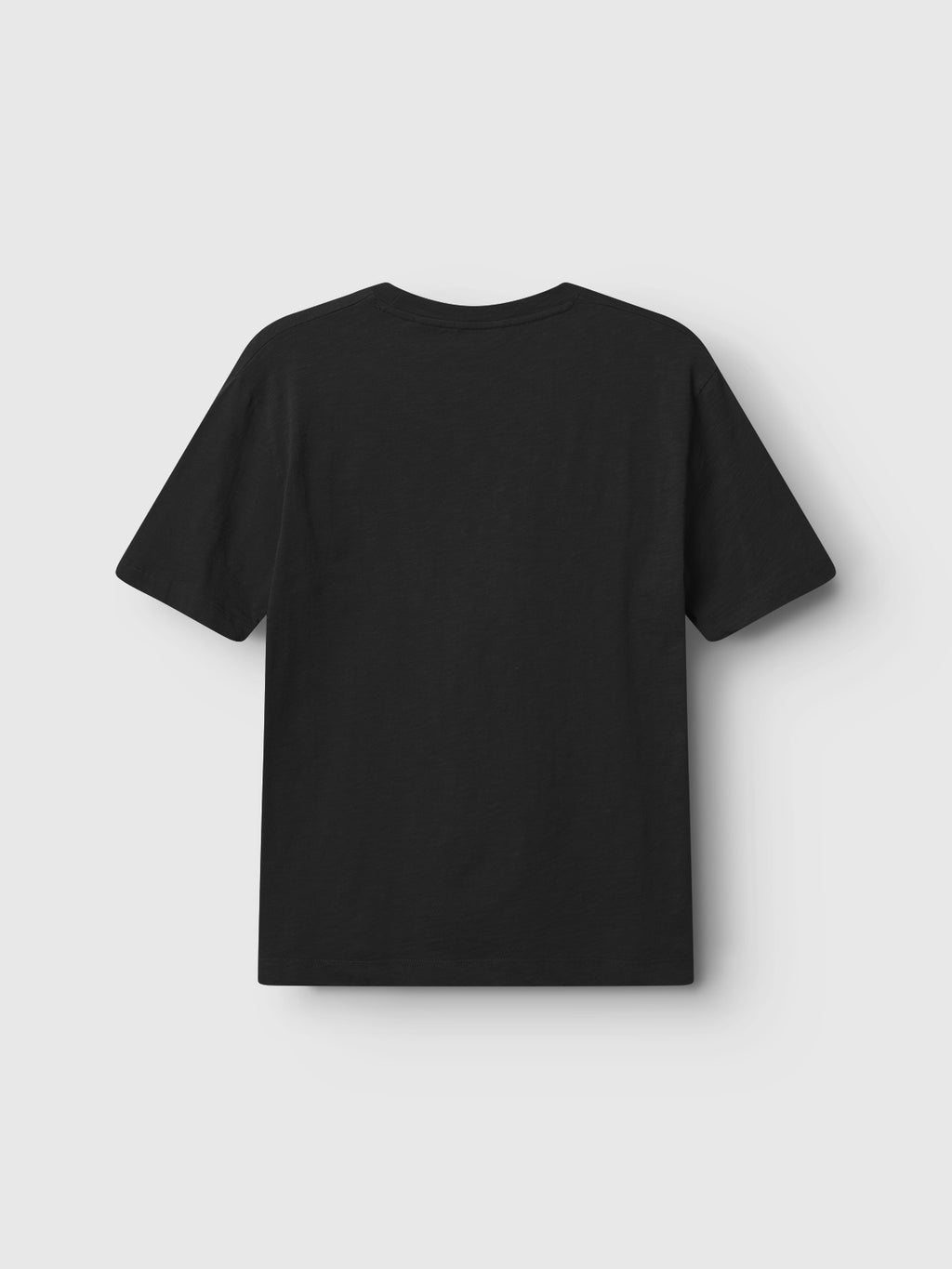 The back of the Gabba Pure Ss - Meteorite tee is shown on a light gray background. This regular fit T-shirt has midweight slub jersey, short sleeves, and a round neckline, providing a smooth texture in plain black.