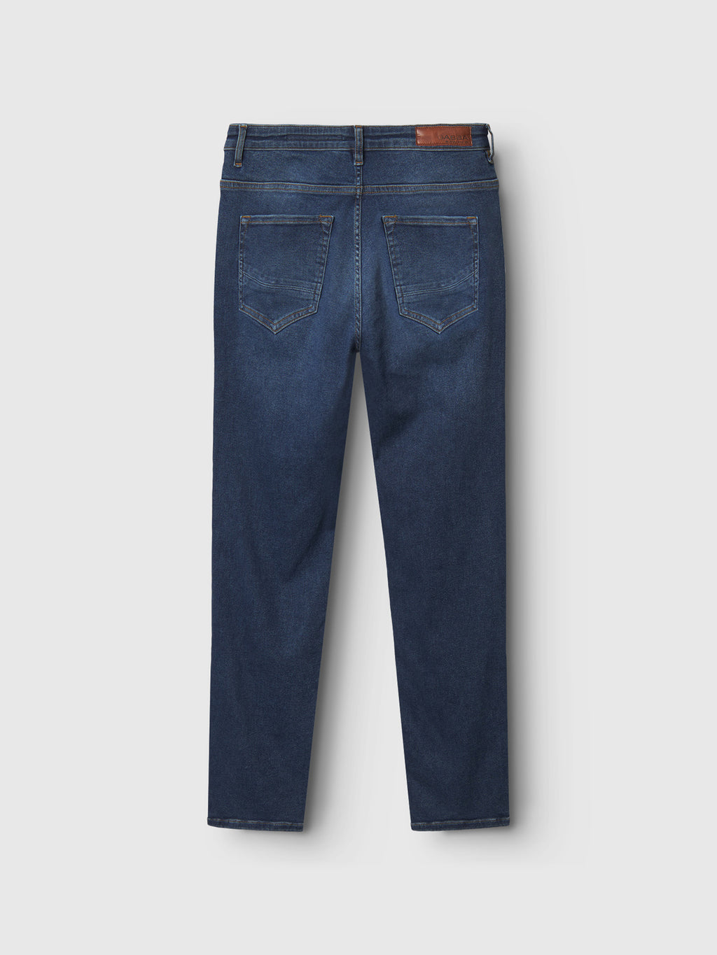 The Marc K4486 Limited - Mid Blue Denim by Gabba features a back view showcasing two back pockets, belt loops, and a brown leather waistband patch. This pair offers a regular fit and classic style against a light gray background.