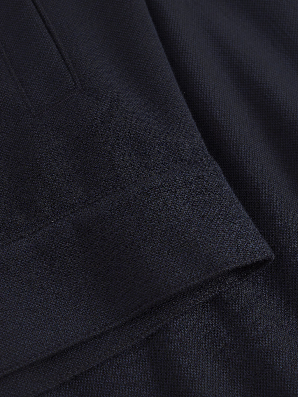 Close-up of the Toto Gknit - Navy by Gabba, a dark viscose mix with a thick, slightly ribbed texture folded at the cuff, ideal for both everyday elegance and formal attire.