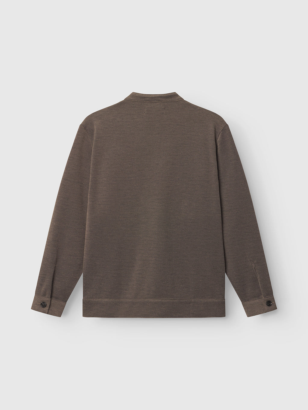 The Toto Gknit - Sand by Gabba is a brown long-sleeve crew neck sweater, showcased from the back. Made from a viscose mix, it features ribbed cuffs and waistband with sleeve button details, ideal for an everyday look against a plain light gray background.