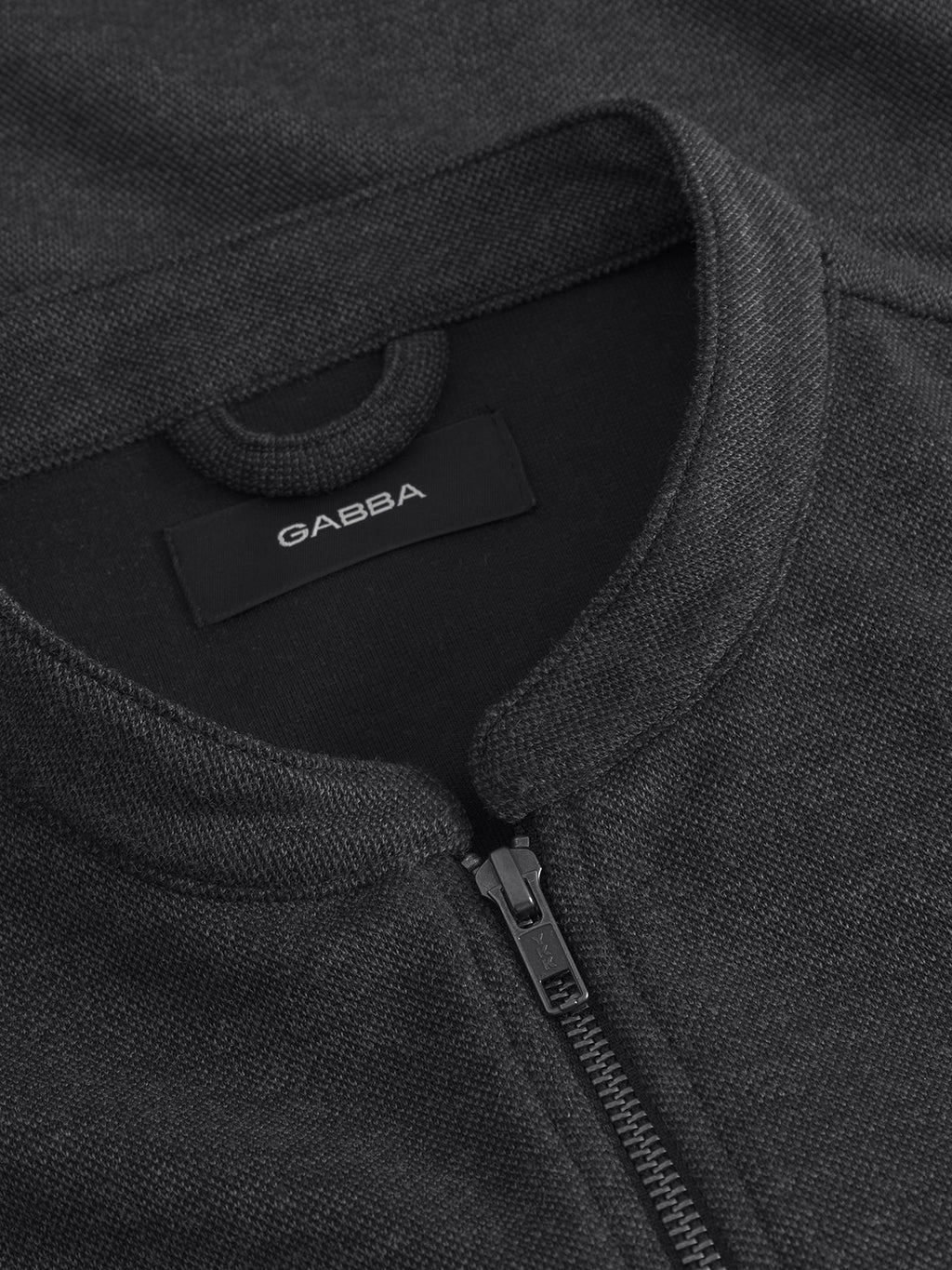 Close-up of the Toto Gknit - Dk. Grey by Gabba, a classic zip-up in soft viscose mix fabric with a visible collar, zipper, and a black Gabba label stitched inside the neckline.