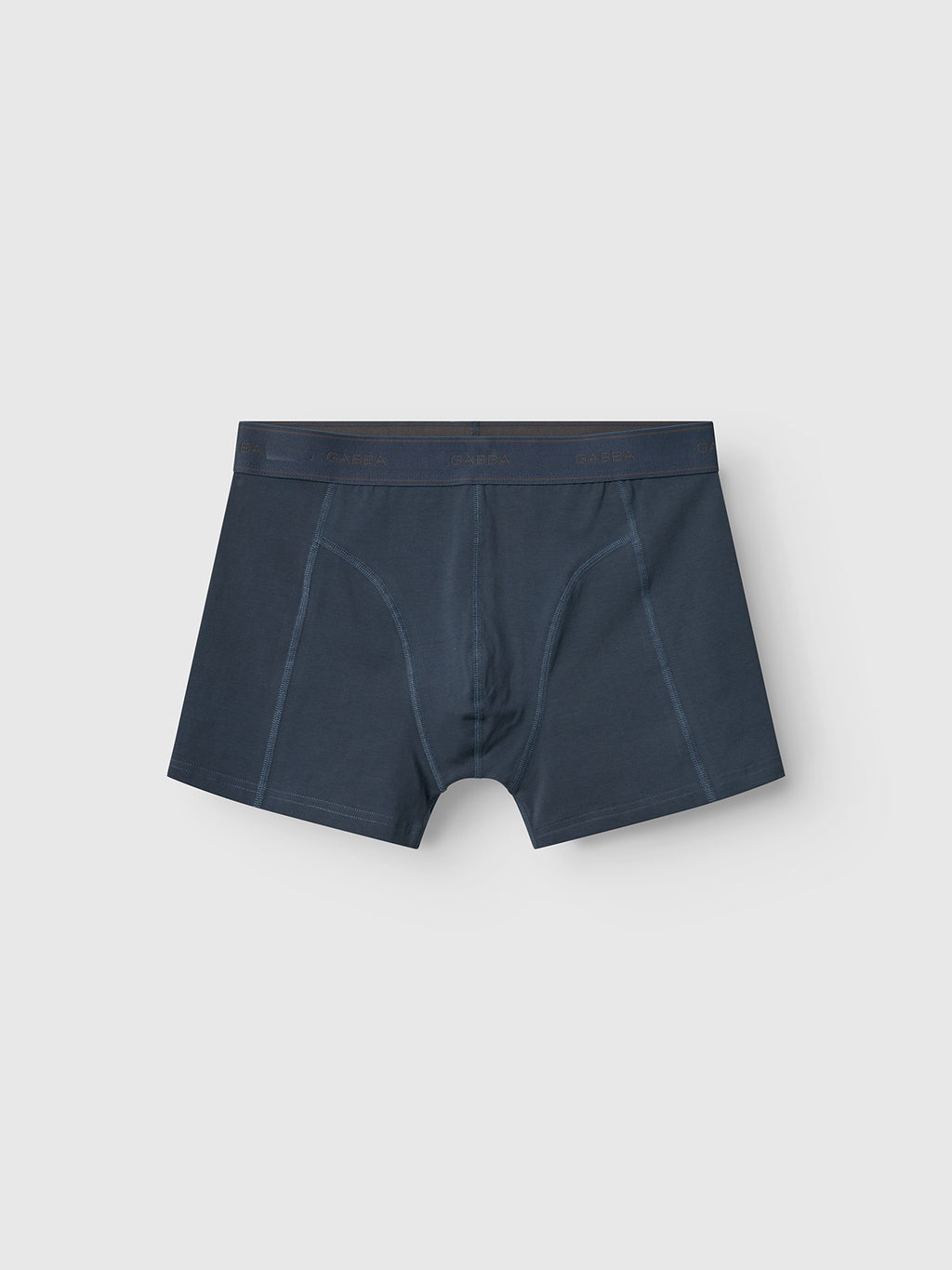 The Gabba Trunk New in Black Iris are dark blue mens boxer briefs, featuring a comfortable cotton blend and an elastic waistband for the perfect fit, all set against a white background.