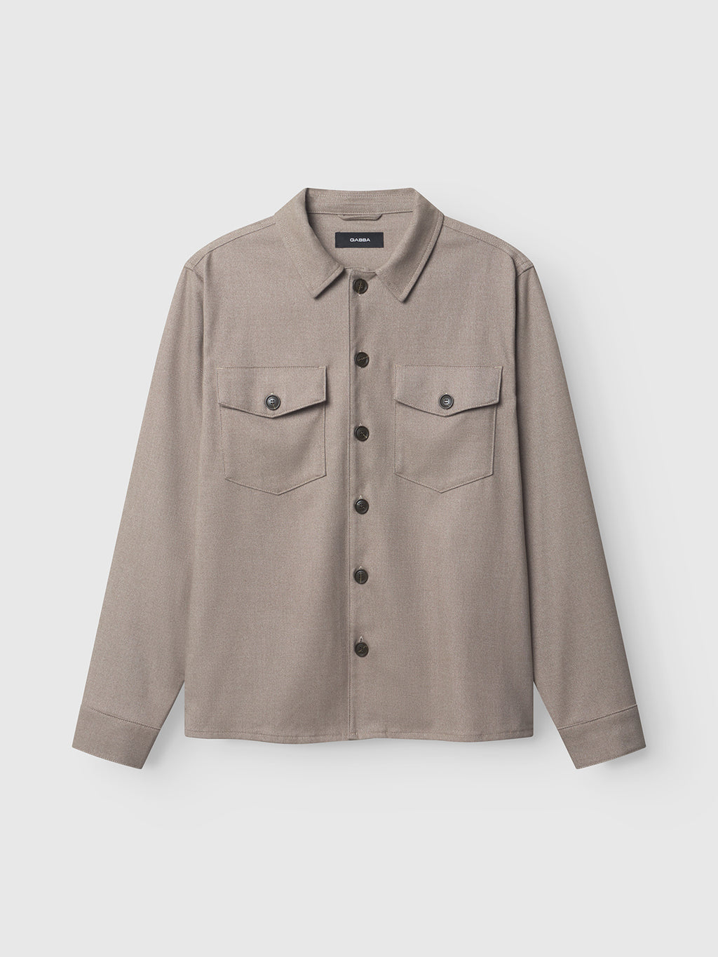 The Clipper Shafi - Brown shirt by Gabba boasts a light brown button-up design with a wool-like texture, elegant stitching, and two chest pockets with buttoned flaps on a plain white backdrop.