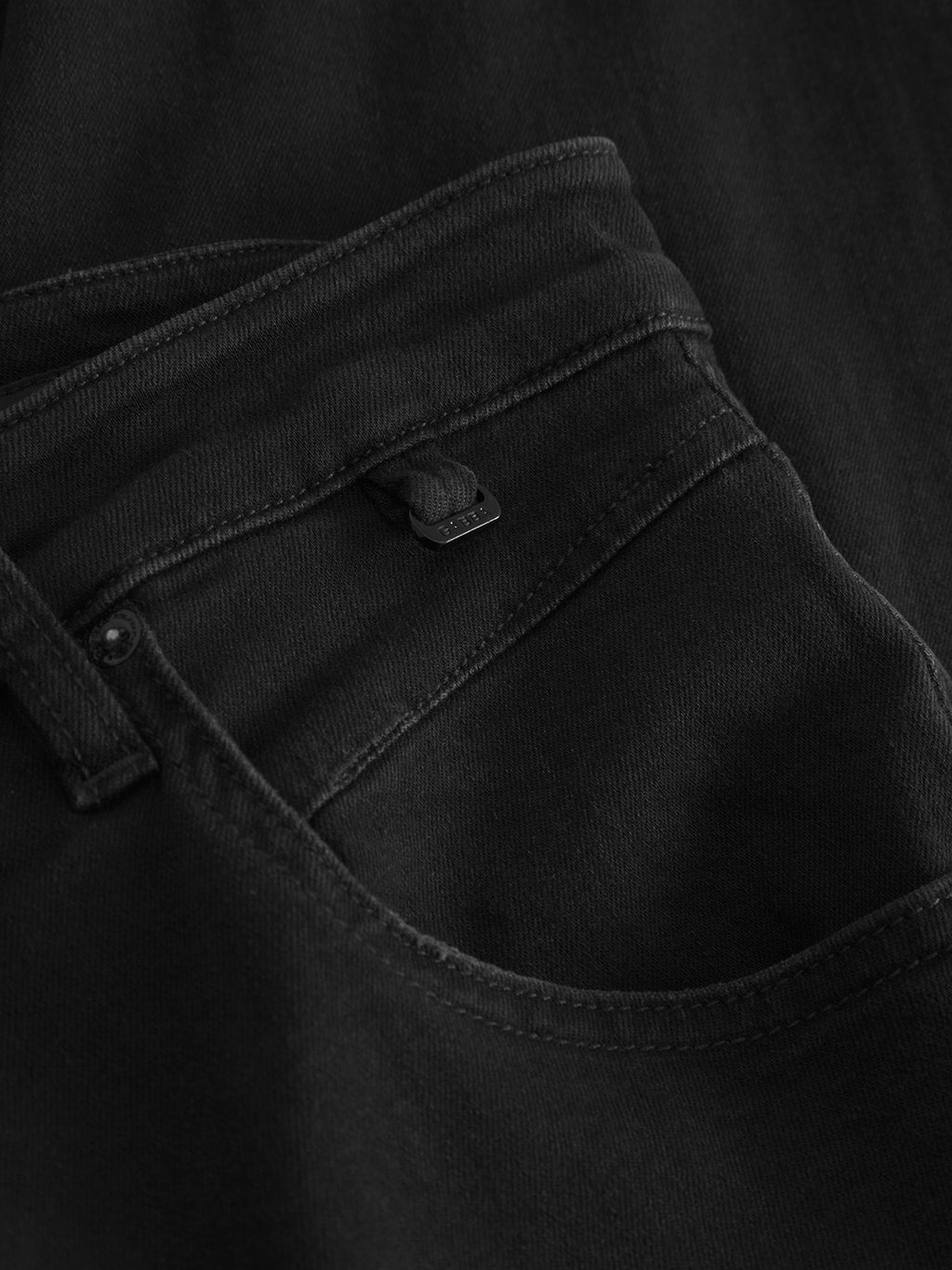 Close-up of the Alex Telsa - Black Denim by Gabba, showing intricate stitching and textured details on the pocket. Worker-cut waistbands add structure, making this trend-focused jean uniquely appealing.