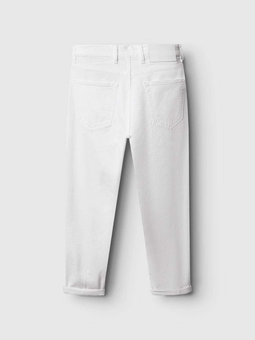 Rear view of Alex Monte - White Denim jeans by Gabba on a white background, featuring large back pockets, belt loops, and slightly cropped legs with rolled cuffs for a casual everyday style.