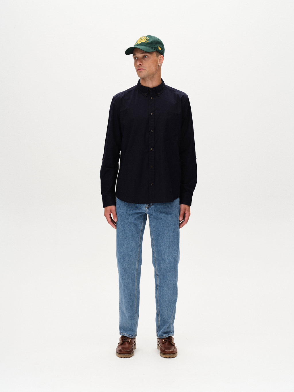 A person wearing the Gabba Bent Reg Ox LS shirt in dark navy stands against a plain white background, looking slightly to the side.