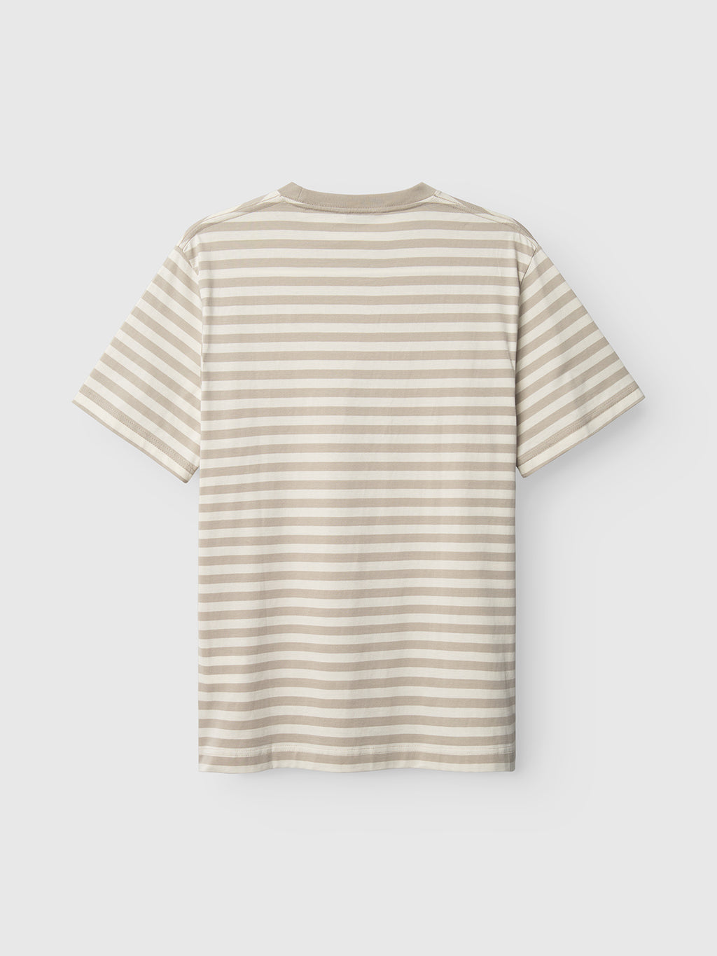 The Gabba Dune Logo Stripes SS GOTS t-shirt, featuring beige and white horizontal stripes, is crafted from GOTS-certified organic cotton. This classic fit tee showcases short sleeves and a timeless round neckline, all set against a plain white background.