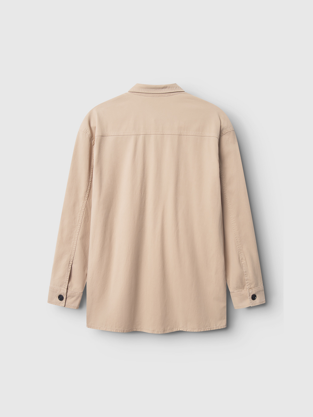 The Gabba Jens Over Lubo LS in sand is a beige, long-sleeve premium shirt with a collar and buttoned cuffs, designed for superior comfort. It’s shown from the back against a plain white background.