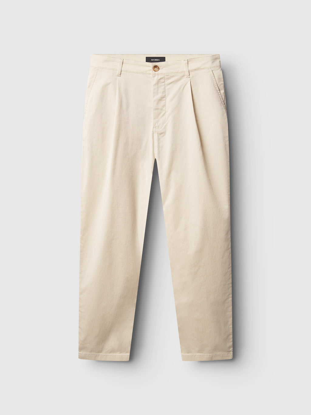 The Gabba Joe Unite - Beige features relaxed-fit pants with a tapered leg, ideal for a casual look, shown against a white background.