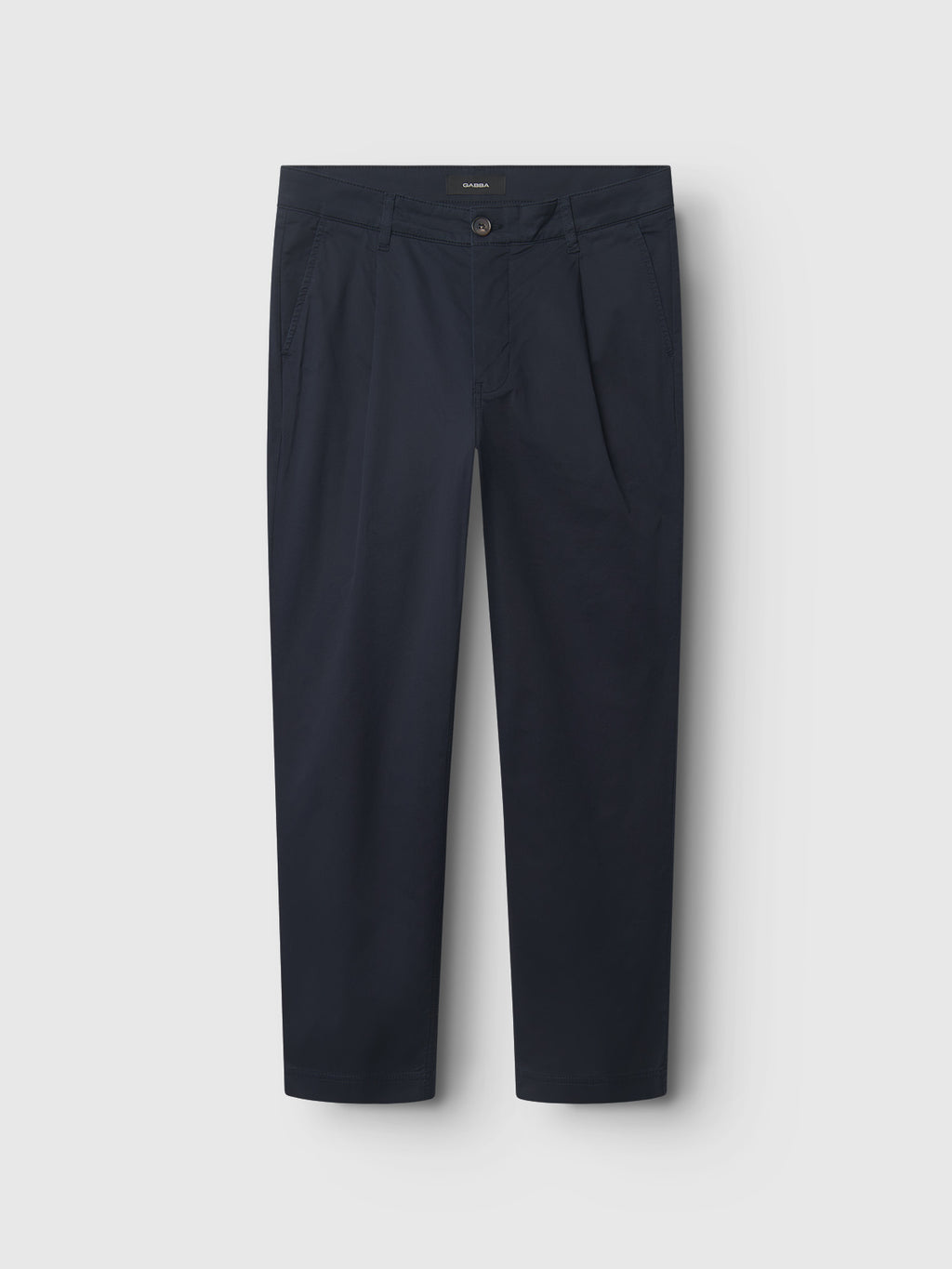 The Gabba Joe Unite - Navy pants are dark blue straight-leg cotton trousers featuring a front button and fly closure, side pockets, and tailored front pleats. Ideal for a casual look, theyre shown against a white background.