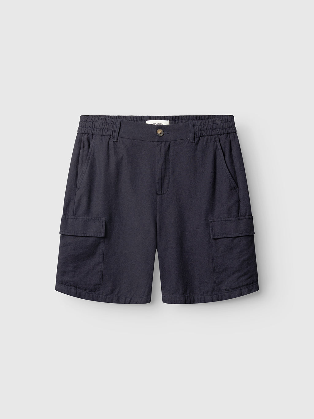The Gabba Alfa Cargo Lino shorts in Night Sky feature an elastic waistband, button closure, side and thigh flap pockets, shown against a light gray background.
