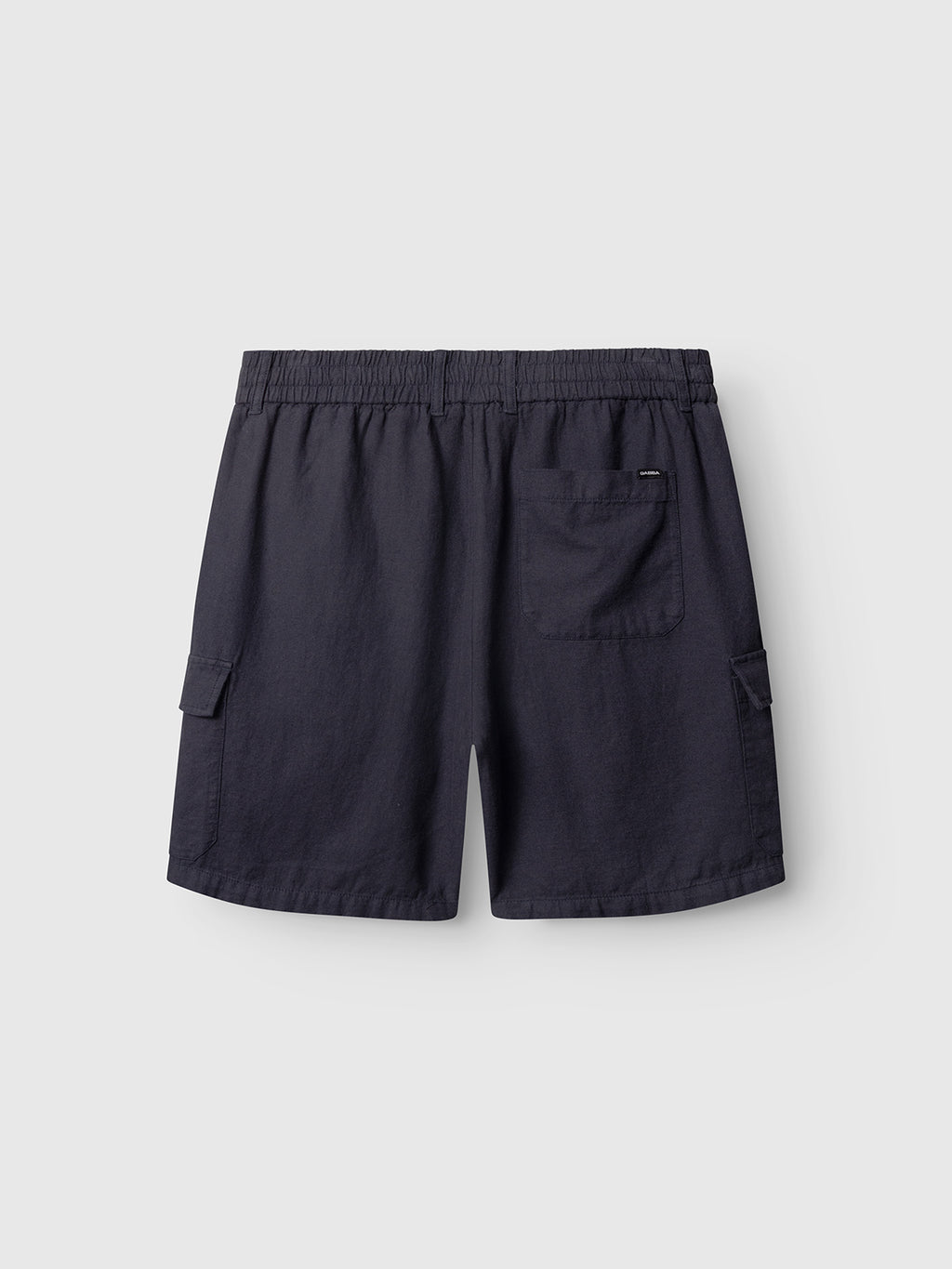 The Gabba Alfa Cargo Lino shorts in Night Sky feature an elastic waistband, right back pocket, and two side cargo pockets, shown against a plain light gray background.