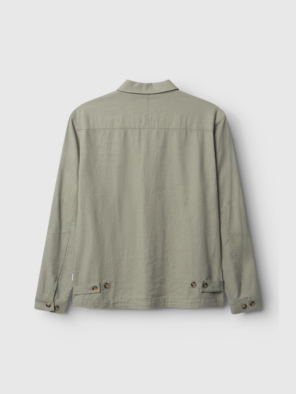 The Gabba GABpeter Lino in light green is a cotton overshirt shown from the back, featuring long sleeves, buttoned cuffs, and adjustable waistband tabs. Its minimalist design makes it perfect for spring layering.