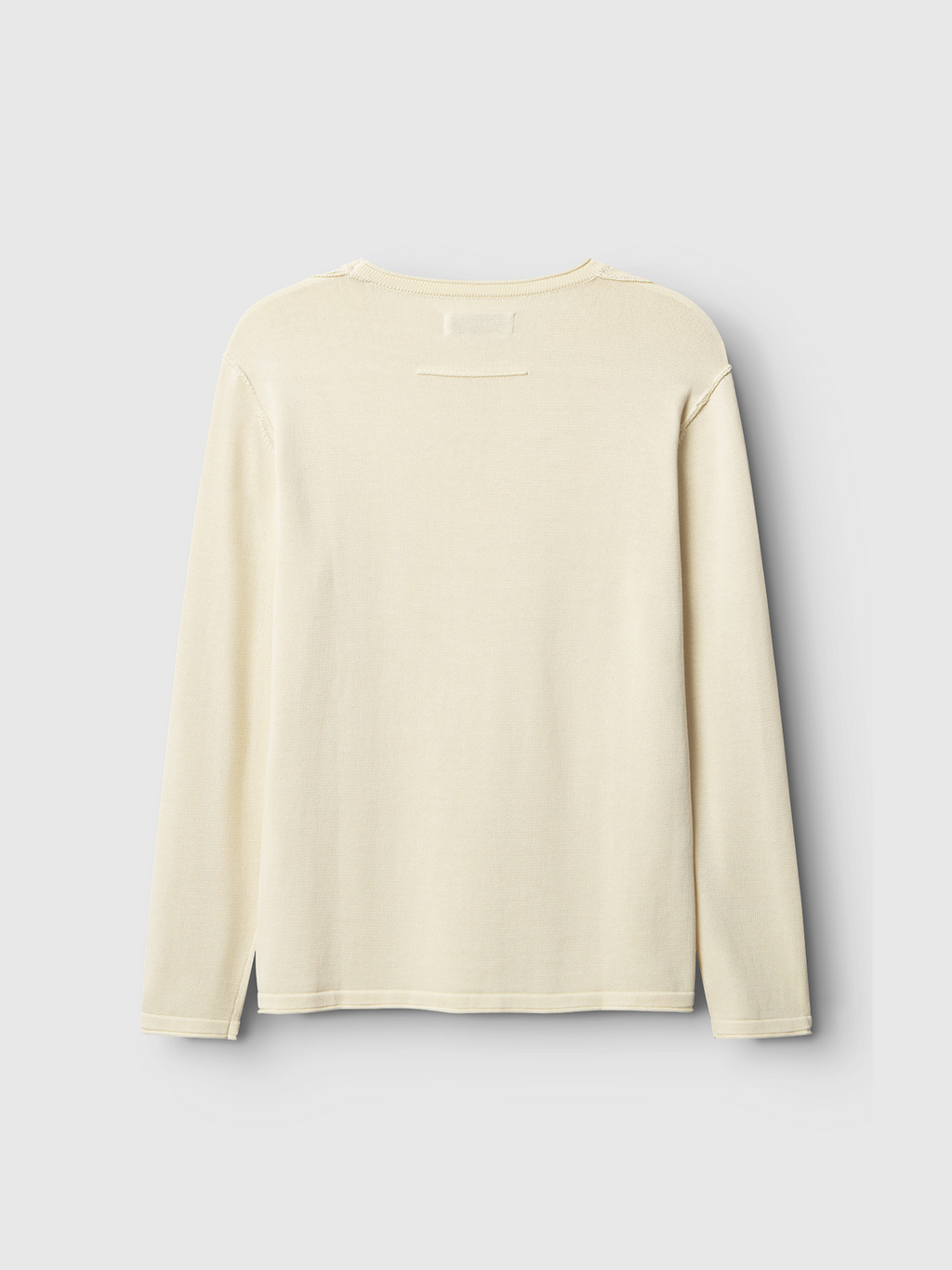 The Bela Fix LS - Ecru Light by Gabba is a cream-colored long-sleeve shirt made from premium 100% cotton knit, set against a light grey background. The back view reveals its simple, logo-free design that emphasizes superior comfort.