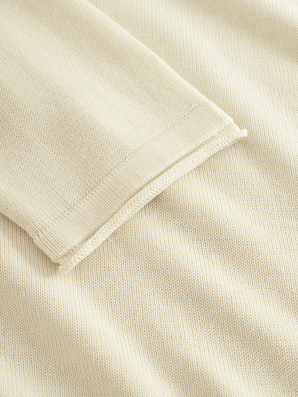 The Bela Fix LS in Ecru Light by Gabba features an intricate cream-colored, fine knit fabric made of 100% premium cotton. Its neatly folded edge and soft, neutral shade ensure a promise of superior comfort.