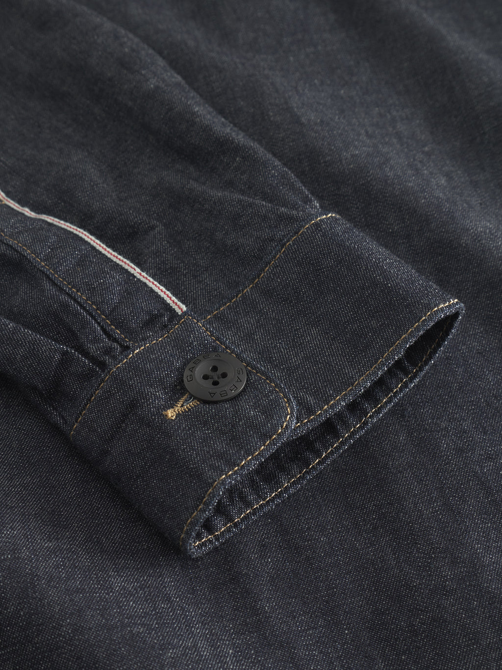 Close-up of Jap Beam - Dark Blue Denim sleeve by Gabba, highlighting the detailed stitching. Made from 100% cotton, the sleeve features a black button on the cuff, with clearly visible denim texture that showcases its richness and quality.