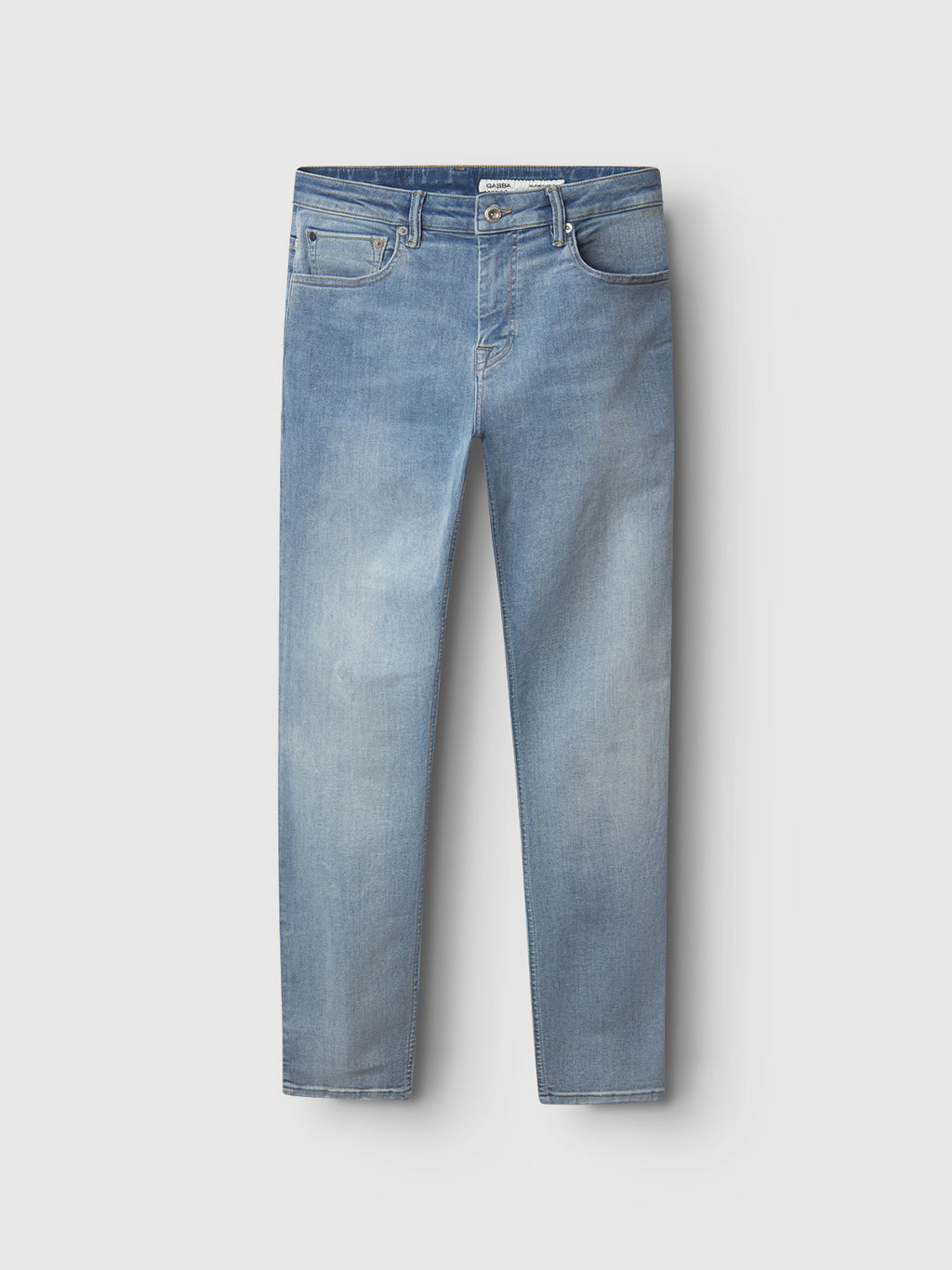 The Jones Just - Lt. Blue Denim by Gabba are light blue, straight-cut denim jeans with a classic five-pocket design. Made from super-stretch fabric, they offer ultimate comfort and feature a slightly faded look, laid flat on a white background.