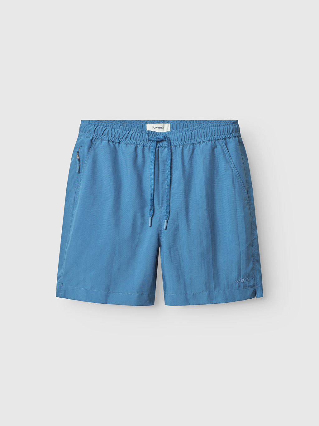 Gabbas Jackson Plain - Blue Horizon swim shorts with an elastic waistband, adjustable drawstring, and side pockets, shown on a plain white background.