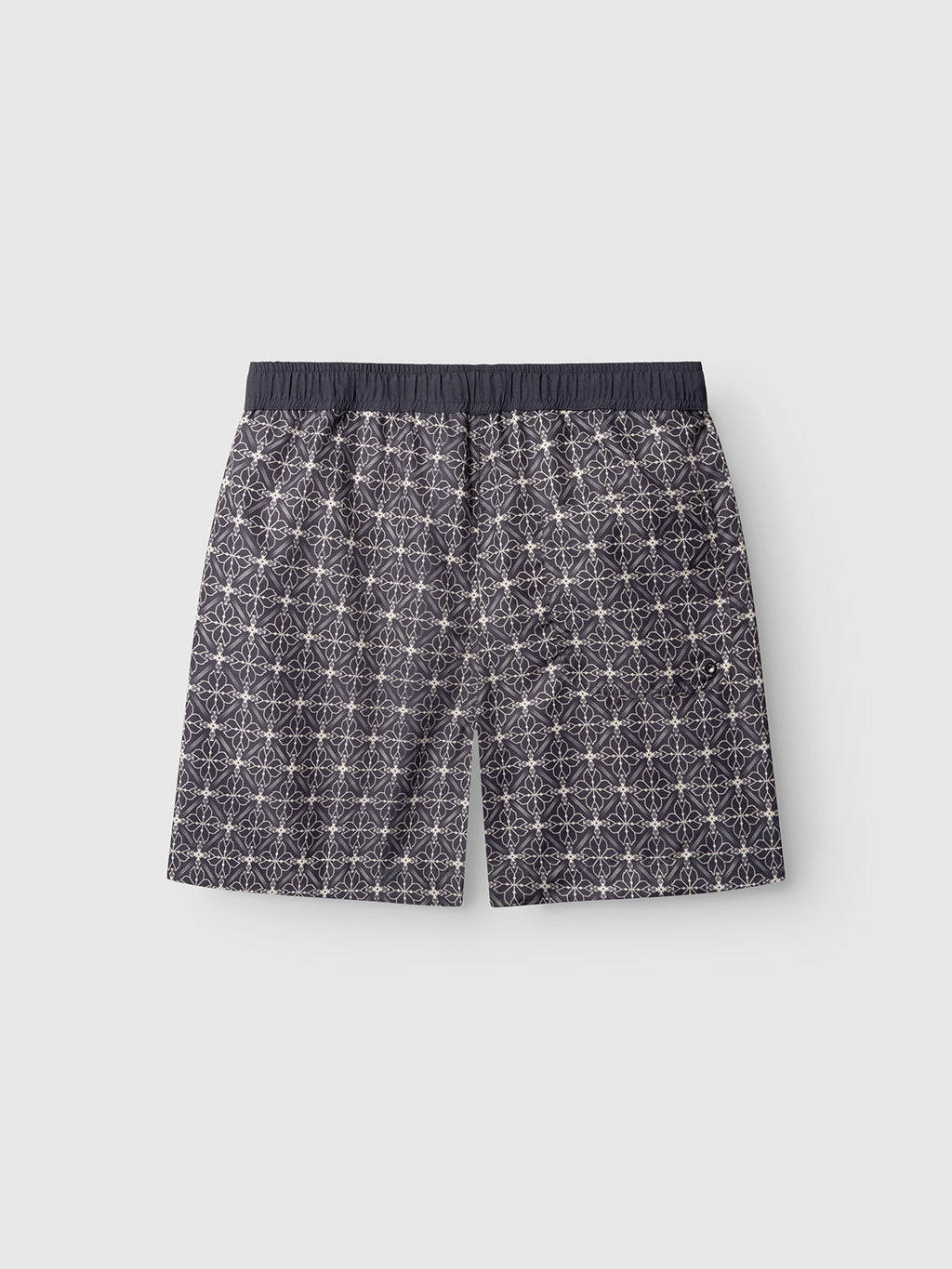 Gabba’s Jackson Print - Multi Pattern men’s boxer shorts feature an elastic waistband, side pockets, and an all-over white starburst design on a dark background. Displayed flat on a plain light gray surface.