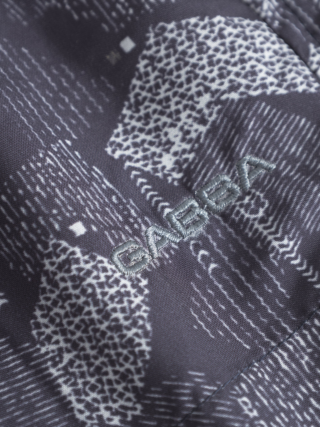 A close-up of the Jackson Print - Blue Pattern by Gabba, highlighting the vibrant design typical of their swim shorts with an elastic waistband.
