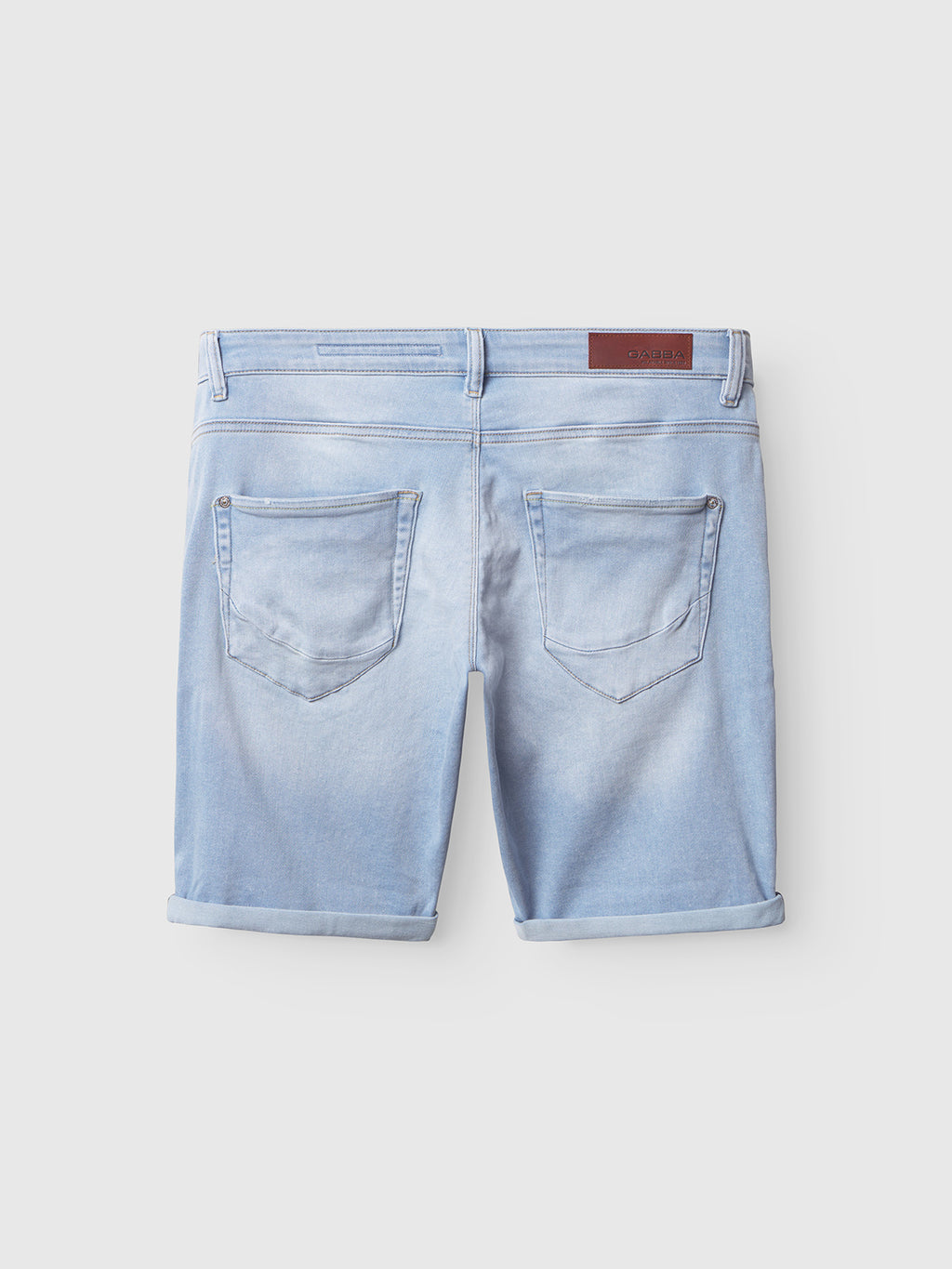 Jason K3787 SANZA Shorts by Gabba feature light blue denim with rolled-up hems, two back pockets, and a brown leather patch on the waistband. Made from super-stretch fabric, these knee-length shorts are displayed flat against a white background.