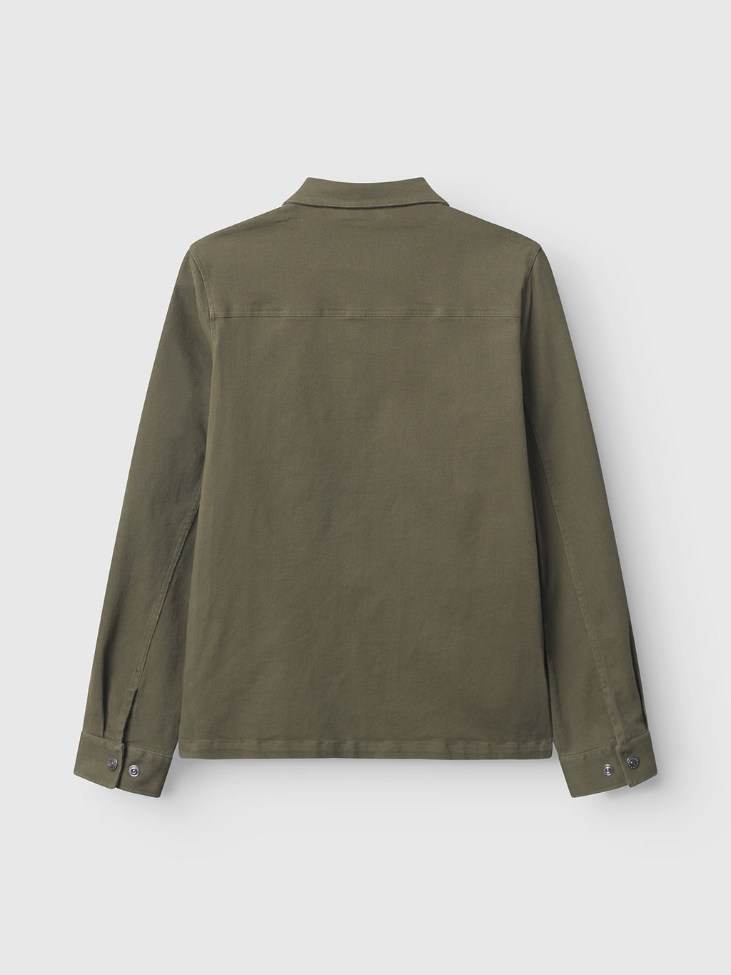 The image shows the back of Gabba’s Beta Twill - Army: a plain, olive green long-sleeve overshirt crafted from garment-dyed twill, featuring a collar, buttoned cuffs, and a clean design without visible patterns or logos.