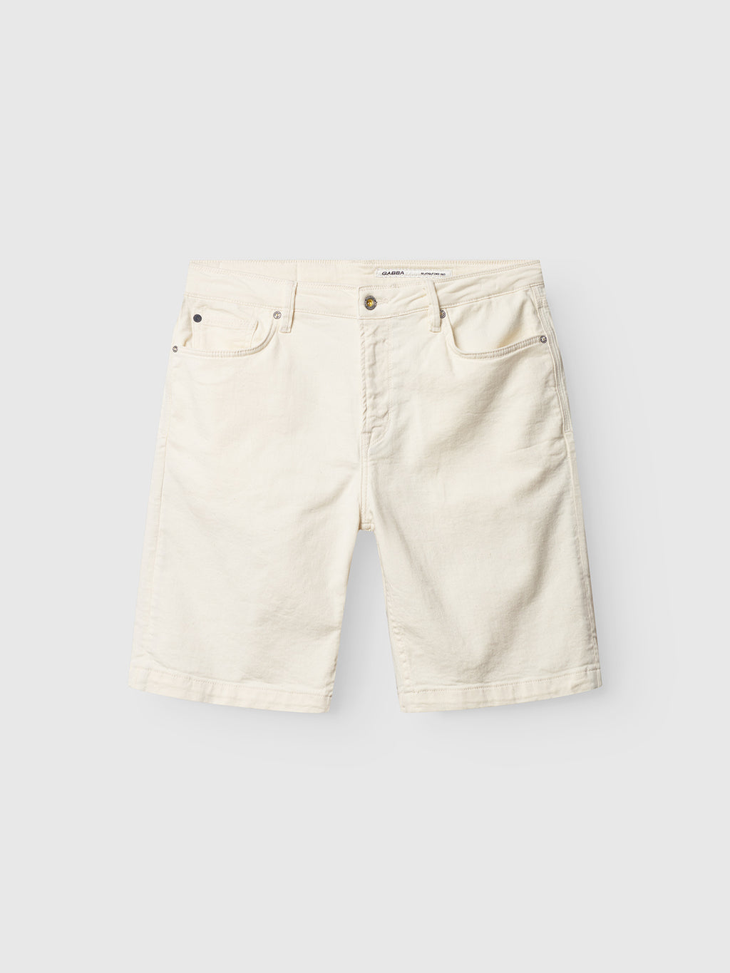 The Maxor Luis Shorts by Gabba, in ecru, are stylish white denim shorts featuring a classic five-pocket style with comfort stretch. They include belt loops and a button closure and are displayed flat against a light gray background.