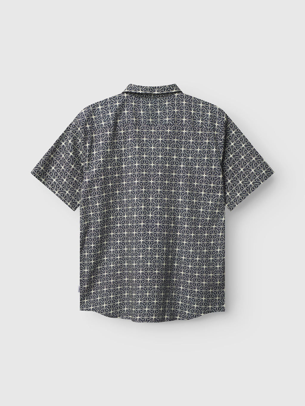 Back view of the Gabba Timo Resort AOP SS - Navy shirt, featuring a short-sleeve design with a dark geometric pattern on a light background. Made from a linen-cotton blend, it has a collar and straight hem for style and comfort, perfect for seasonal print enthusiasts.