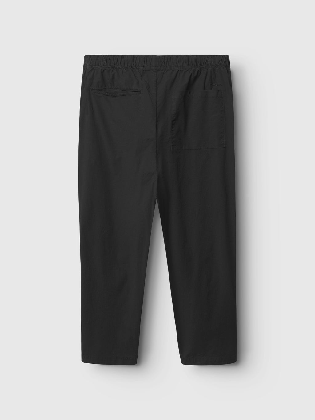The Topgun Jash - Black by Gabba are black technical pants, featuring an elastic waistband and two back pockets, crafted from durable ripstop fabric and displayed against a plain white background.