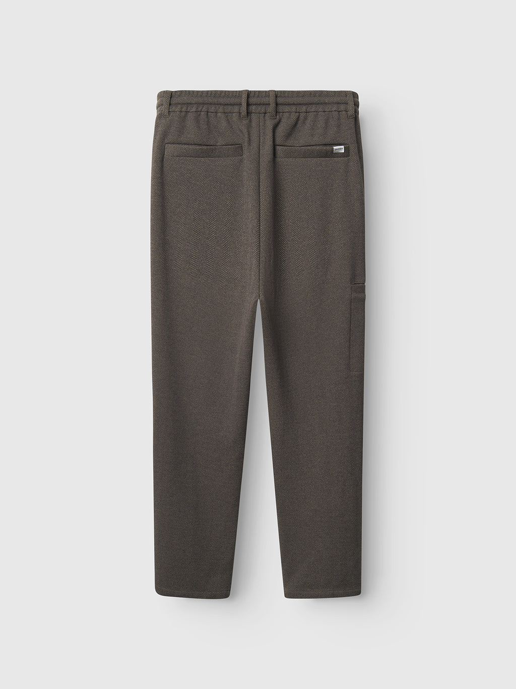 The Napoli 19 Tweed - Brown by Gabba is a classic brown pair of trousers with an elastic waistband, belt loops, and two back pockets, displayed from the back against a light gray background.