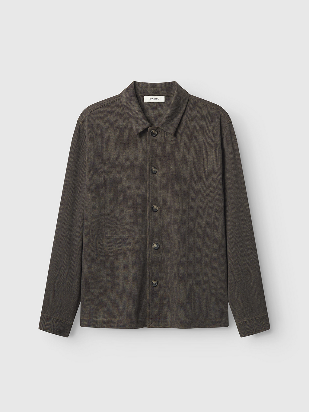 The Peter Tweed - Brown from Gabba features a long-sleeved, button-up design with a collar and an elegant style. Its showcased against a plain white background, accentuating its tailored fit.