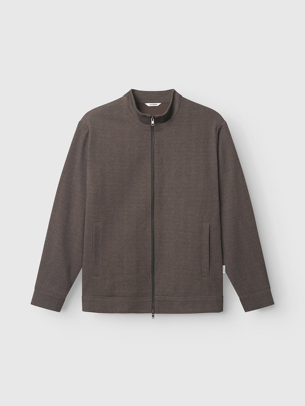 The Gabba Nik Tweed jacket, in brown, is showcased against a white background. It has a high collar, long sleeves, two side pockets, and offers a clean design made from tweed fabric perfect for everyday wear.