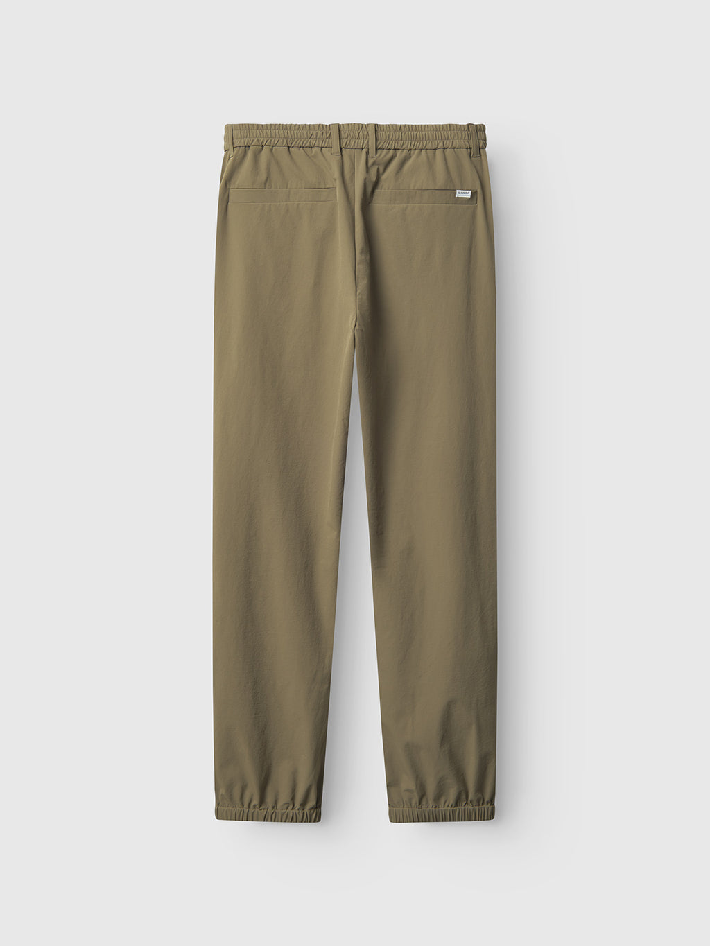 The Gabba Napoli 19 Tech - Army pants, shown from the back in olive green, feature a versatile design with an elastic waistband, two back pockets—one with a small label—and elasticated ankle cuffs set against a plain light gray background.