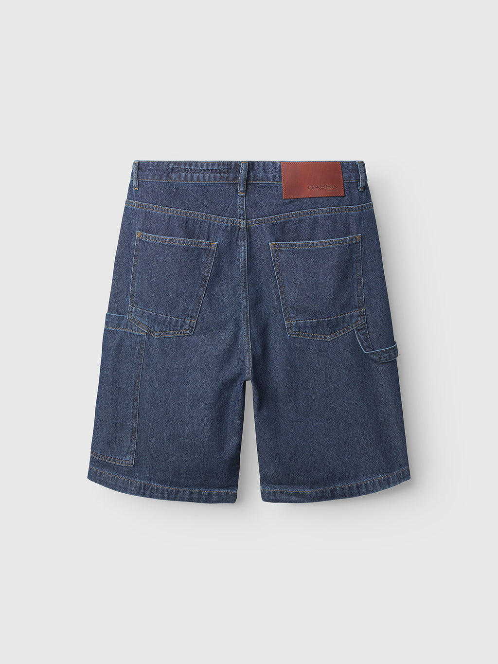 The rear view of Gabbas Ugo Cargo Fone in Mid Blue Denim features iconic workwear style with two large pockets, a brown leather waistband patch, yellow stitching, and an extra utility pocket on one side.