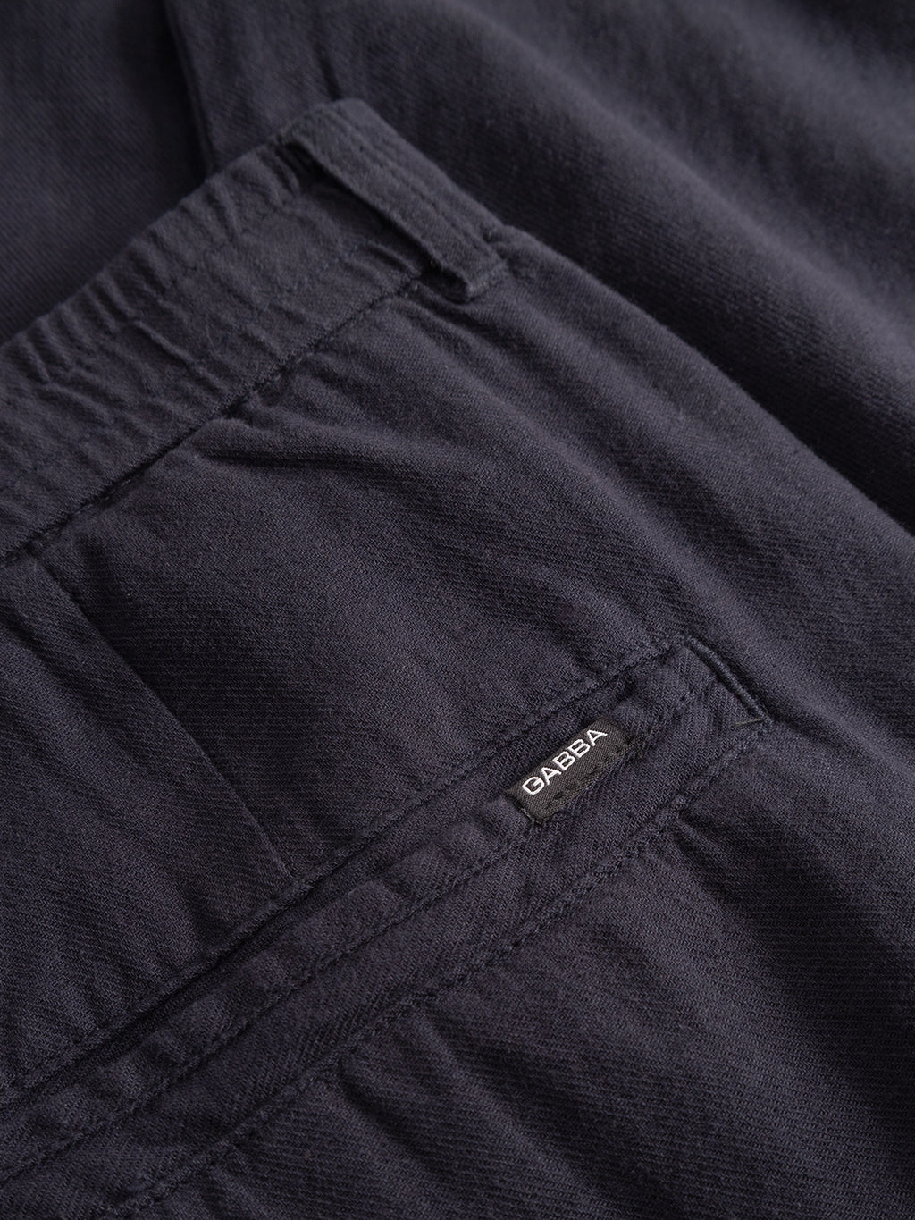 Close-up of Gabba’s Monza Lino Cropped pants in Night Sky, featuring a back pocket with a small Gabba tag and an elastic waist—ideal for comfort and those seeking a straight fit.
